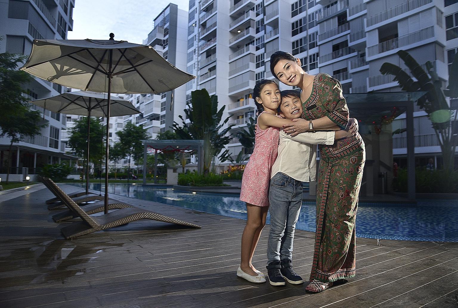 Ms Christina Chia with her daughter Charlize, 11, and son Paxton, eight. Technology such as mobile phones and video chats help her stay in touch with her children when she is away. Being a stewardess also means she does not bring work home, so she is