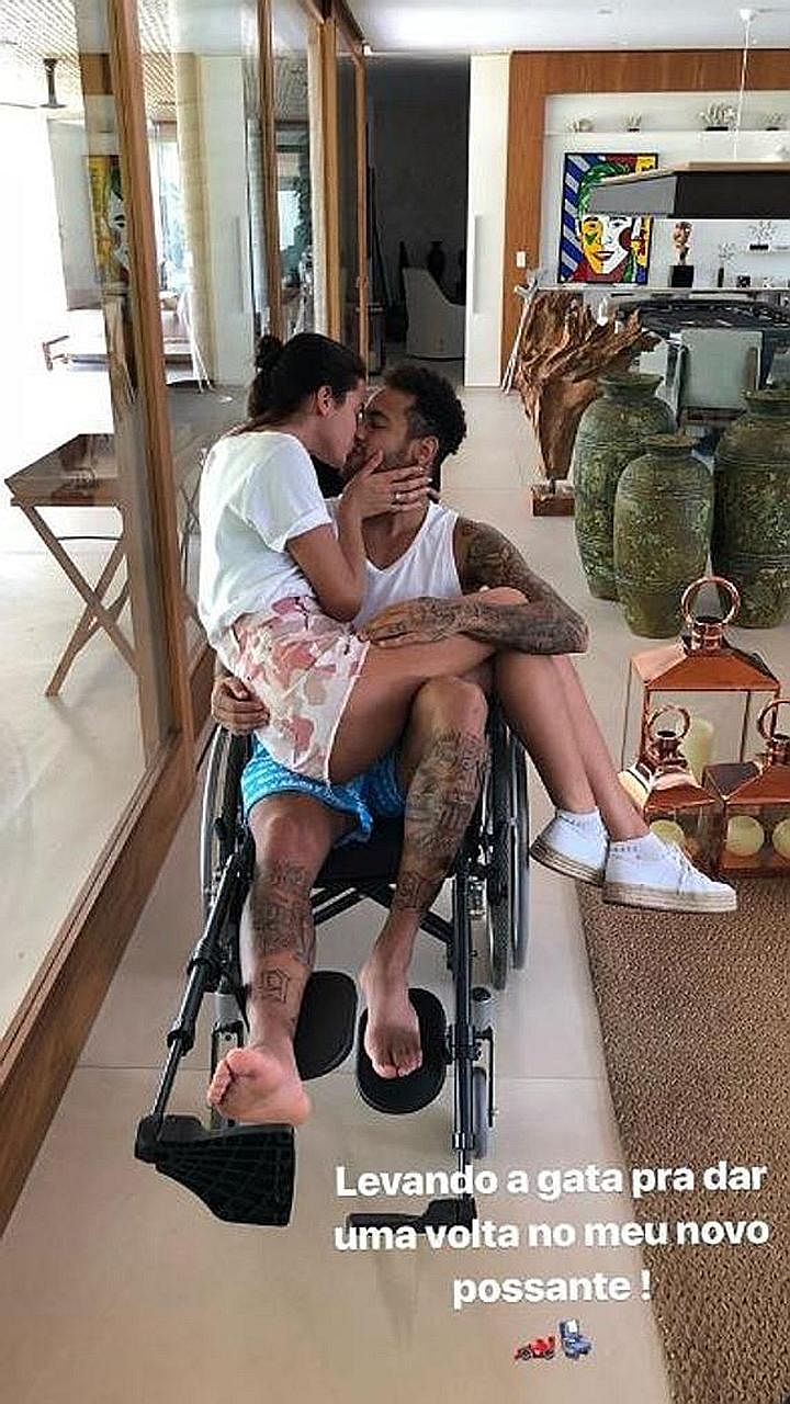 Wheelchair-bound Neymar sharing a tender moment with his actress girlfriend Bruna Marquezine. The Brazilian faces an uncertain spell on the sidelines after undergoing surgery to mend his metatarsal.