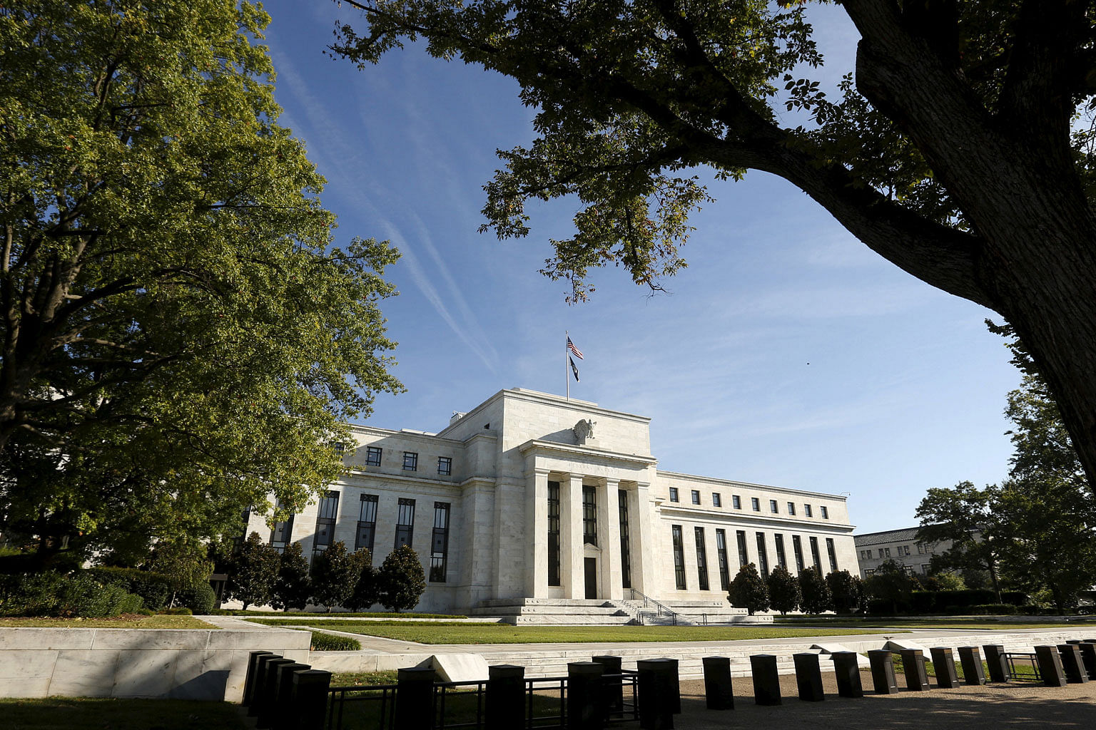 The Federal Reserve headquarters in Washington. UBS now expects the Fed to hike interest rates four times in 2018 (from three) and three times in 2019 (from two), taking the Fed fund target rate to just over 3 per cent by end-2019.