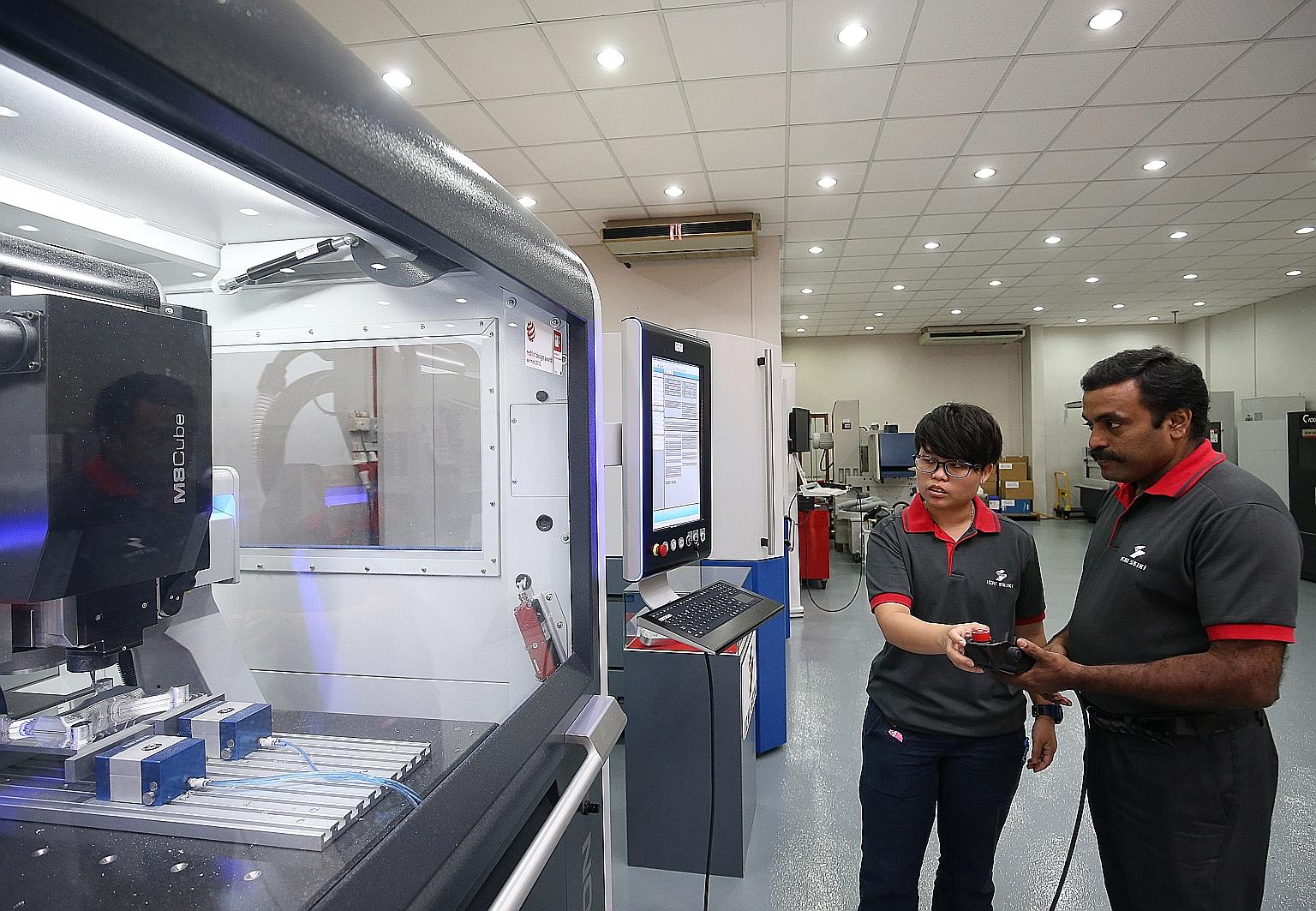 Ichi Seiki application engineer Chui Kher Ning has trained fellow application engineer Krishnan Thiagarajan to use the company's new precision engineering machines, after she was trained by German specialists last year.