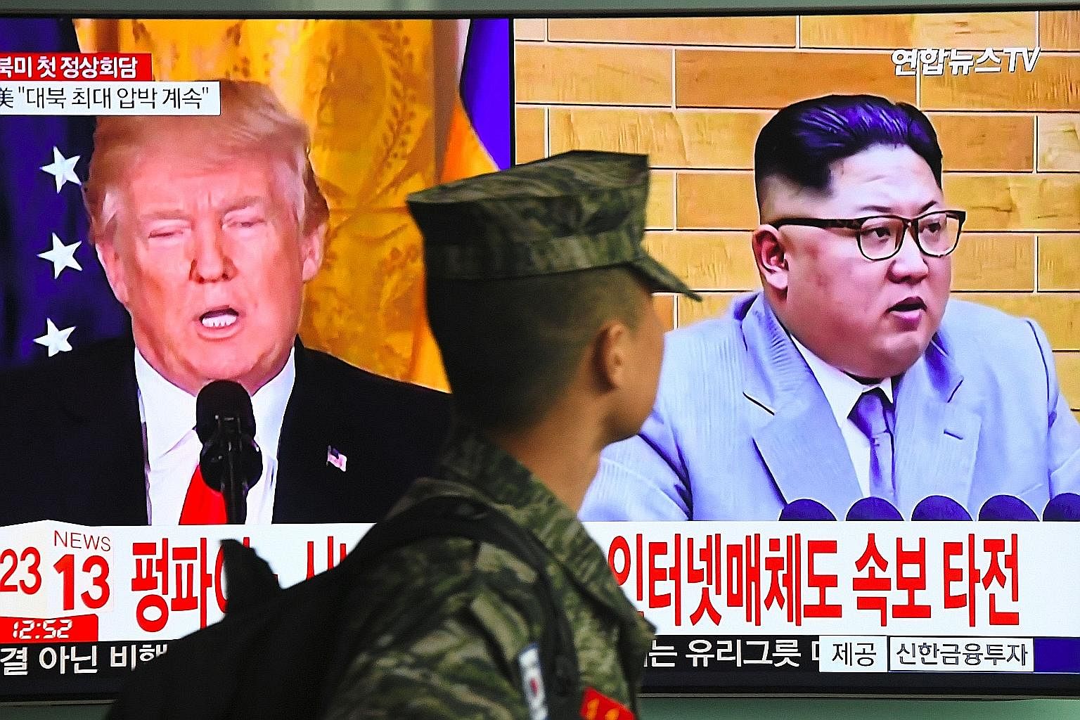 A television screen showing pictures of Mr Donald Trump and Mr Kim Jong Un at a Seoul railway station on Friday.