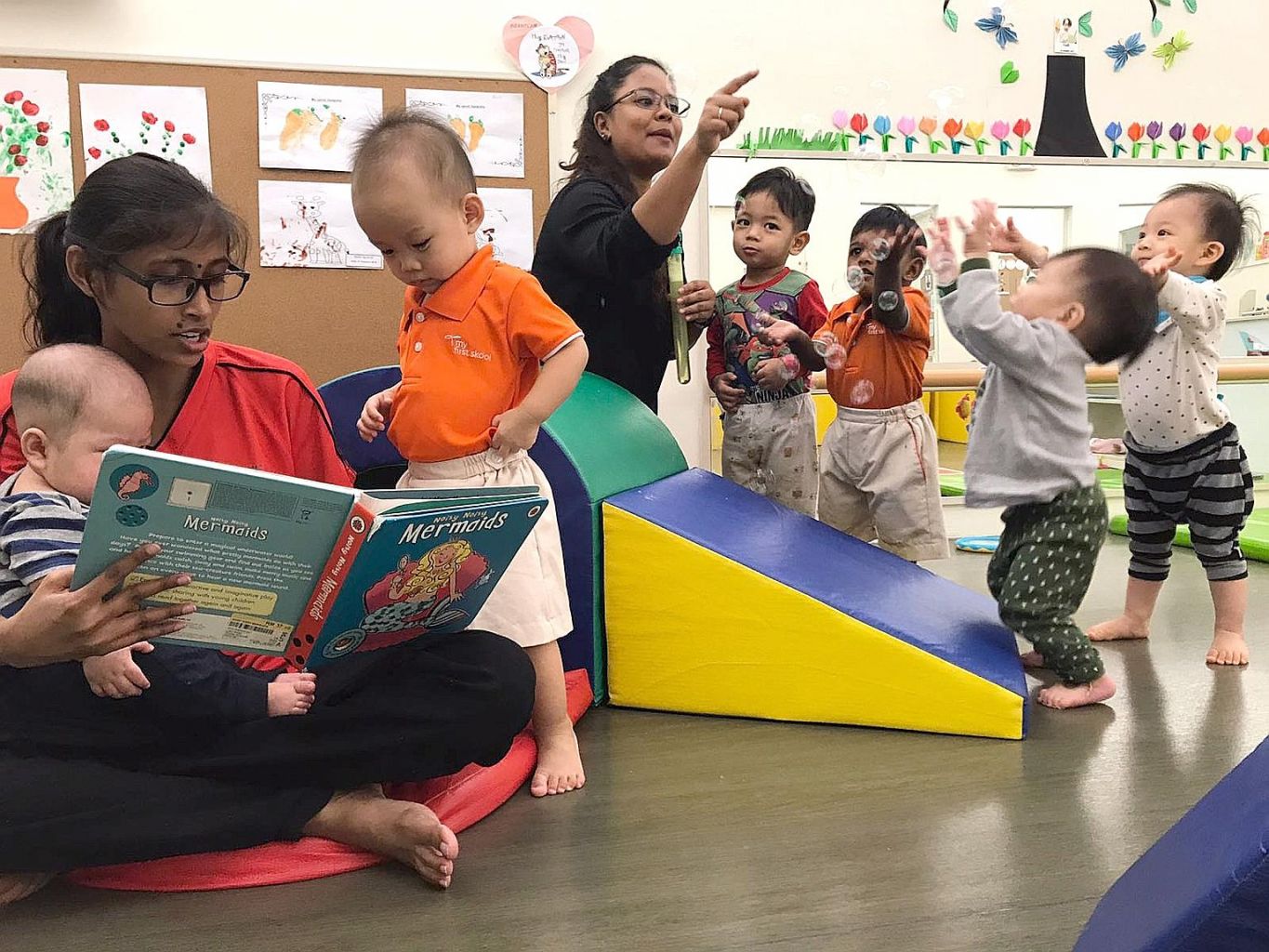 Toddlers and infants learning and playing in the same premises at My First Skool in Havelock Road as part of a co-sharing pilot for infants and toddlers, which allows them to continue to grow in familiar places and with familiar faces.