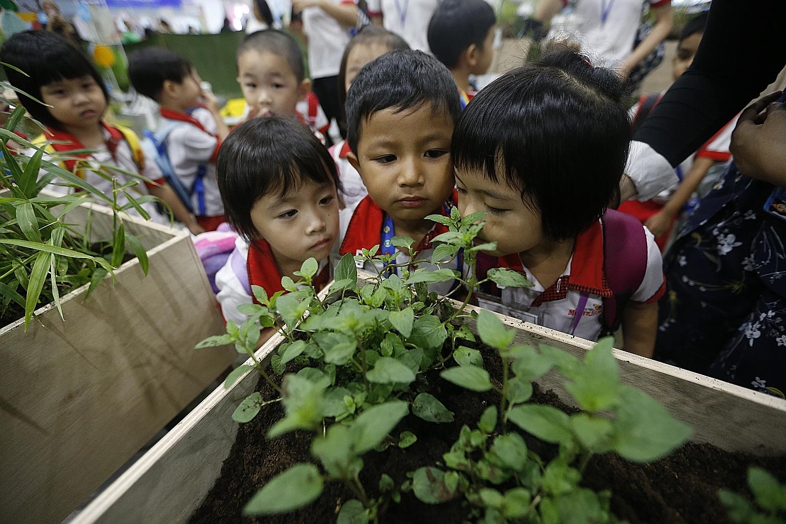 Children can smell different flowers and herbs as well as make music with wooden "percussion frogs" at SmartKids Asia 2018, which runs until tomorrow at the Singapore Expo.