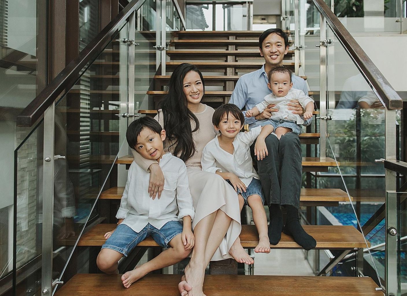 Entrepreneur Elaine Kim with her husband John, and sons (from far left) Kyan, six, Luke, five, and Nate, one. Dr Kim believes that greater business networking support for women, and flexible work schemes can help women get ahead in their careers.