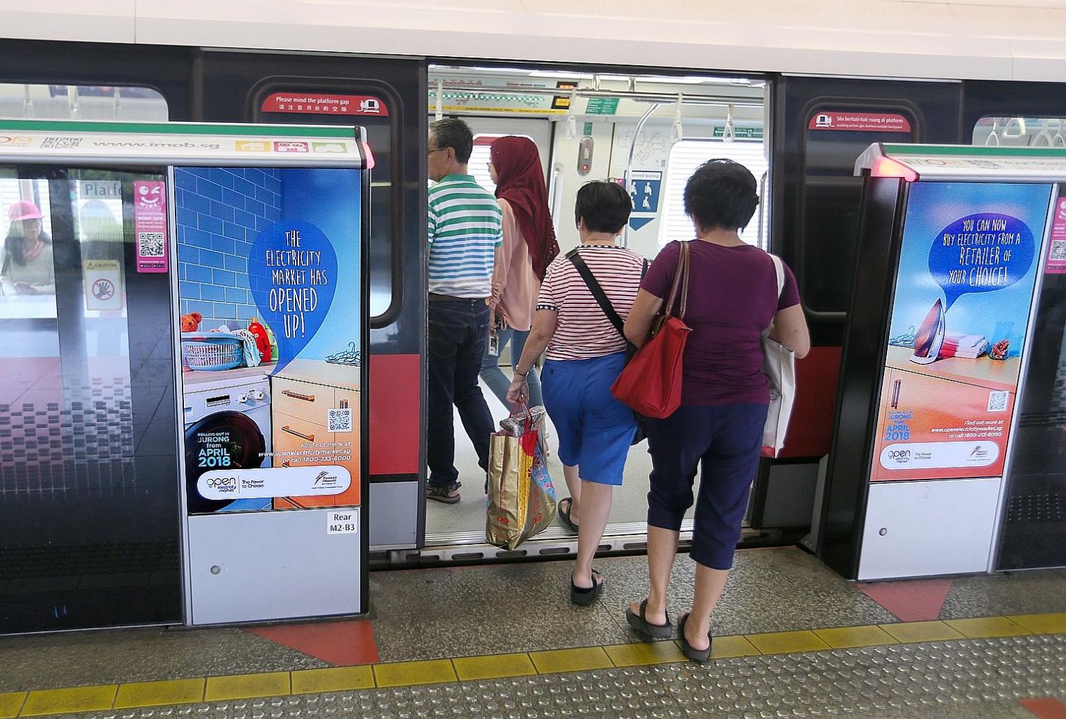 Advertisements at Boon Lay MRT station about the open electricity market, which will give 108,000 households and 9,500 businesses in Jurong the opportunity to buy electricity from a retailer of their choice.