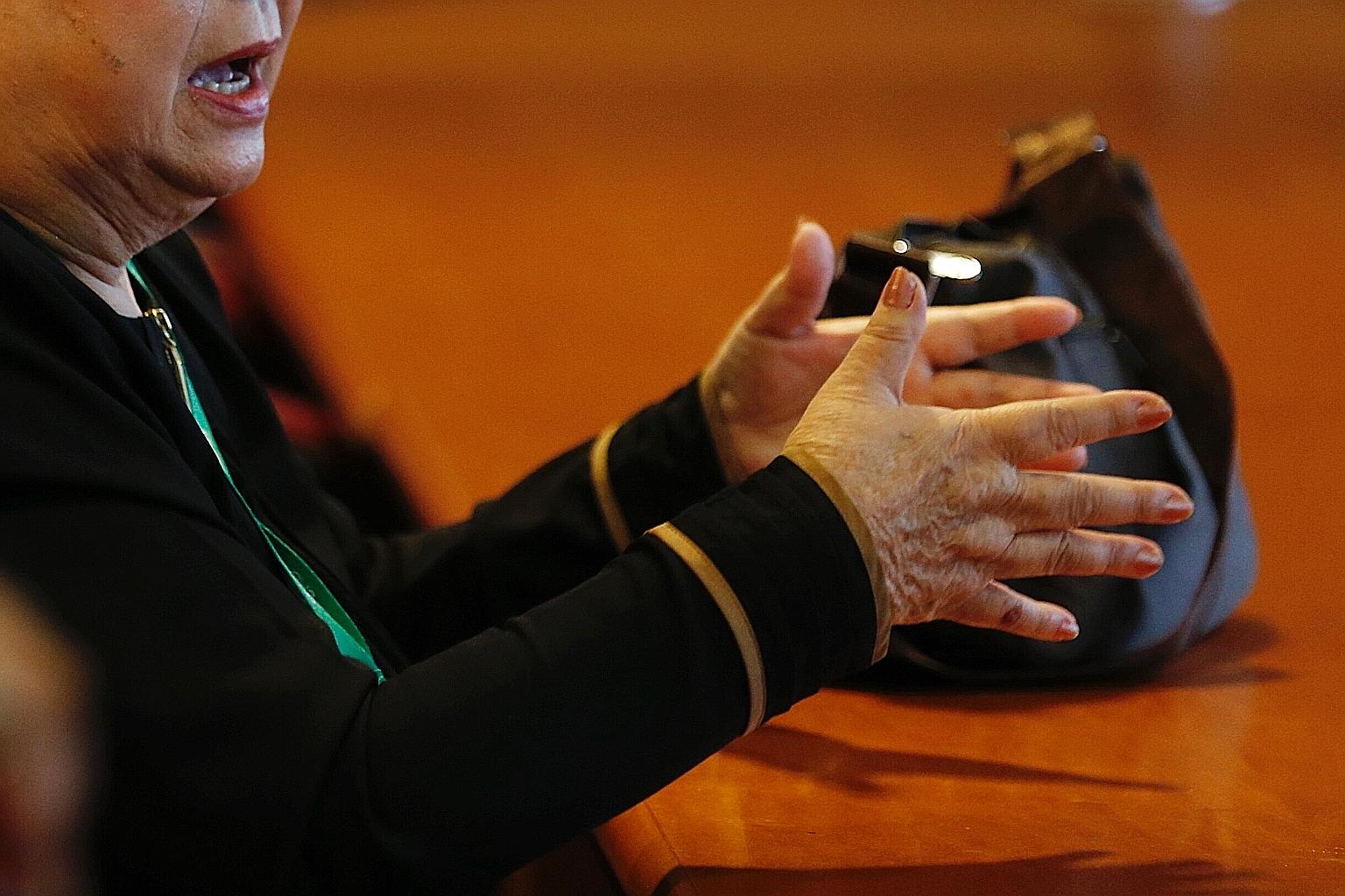 Ms Rosie (not her real name), 70, at a police press conference yesterday. She described how a man she met on Facebook had cheated her of $8,000. She nearly became a money mule too, but was warned in time by an officer from the Commercial Affairs Depa