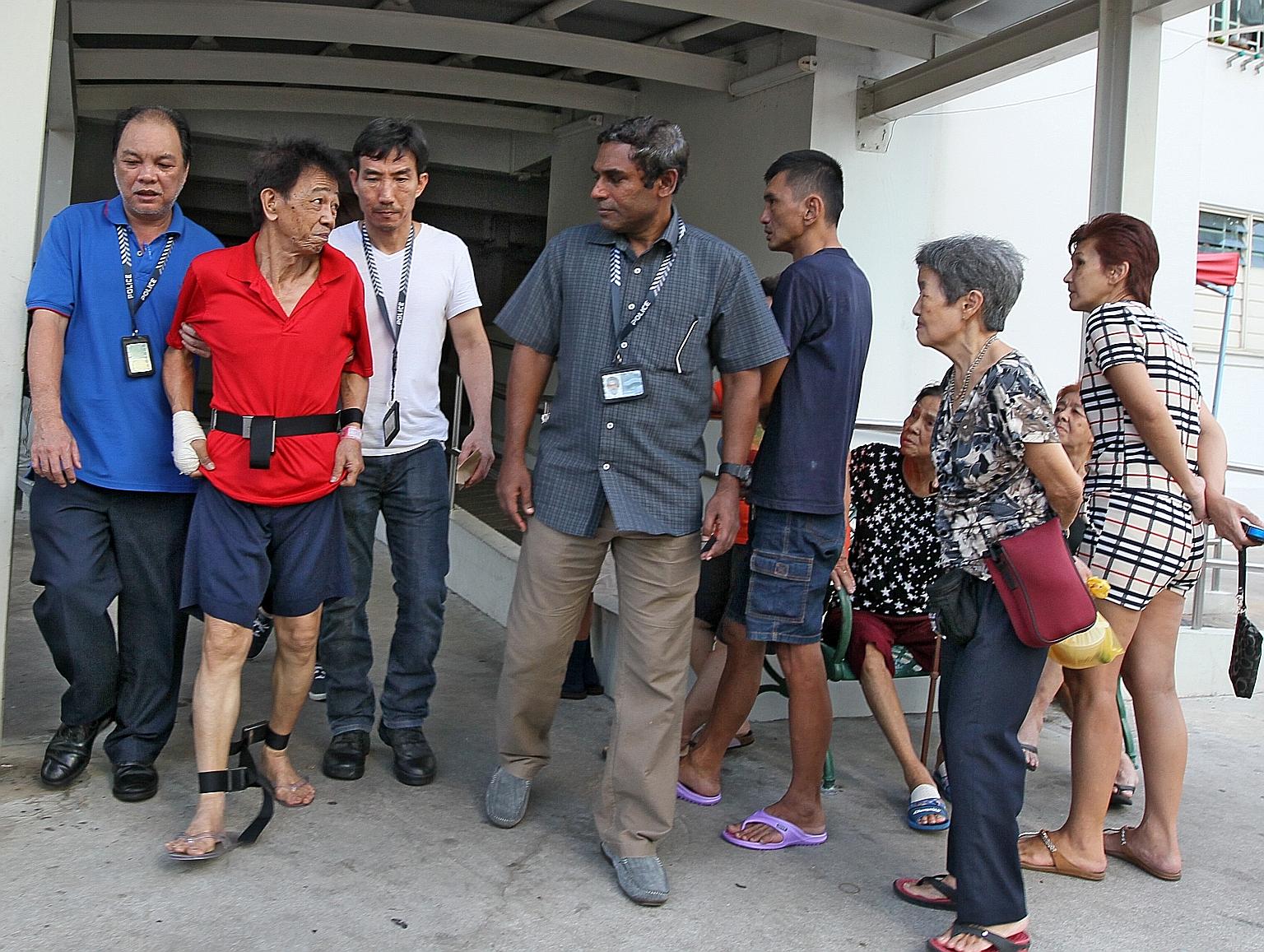 Tan Kim Hock was taken back to the rental flat in Bendemeer Road by the police during investigation. He had attacked welder Fan Fook Heng with a knife in June 2016 during a quarrel over the sound of a cup being washed.