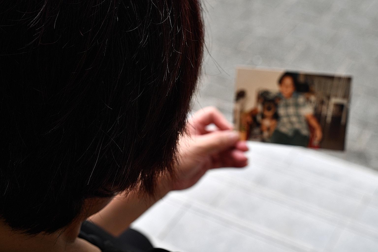 Mrs Dorcas Lee with a picture of her son, Z. She remembered how her son had brought back a sick bird to nurse till well and released it, and how he cried when his hamster died.