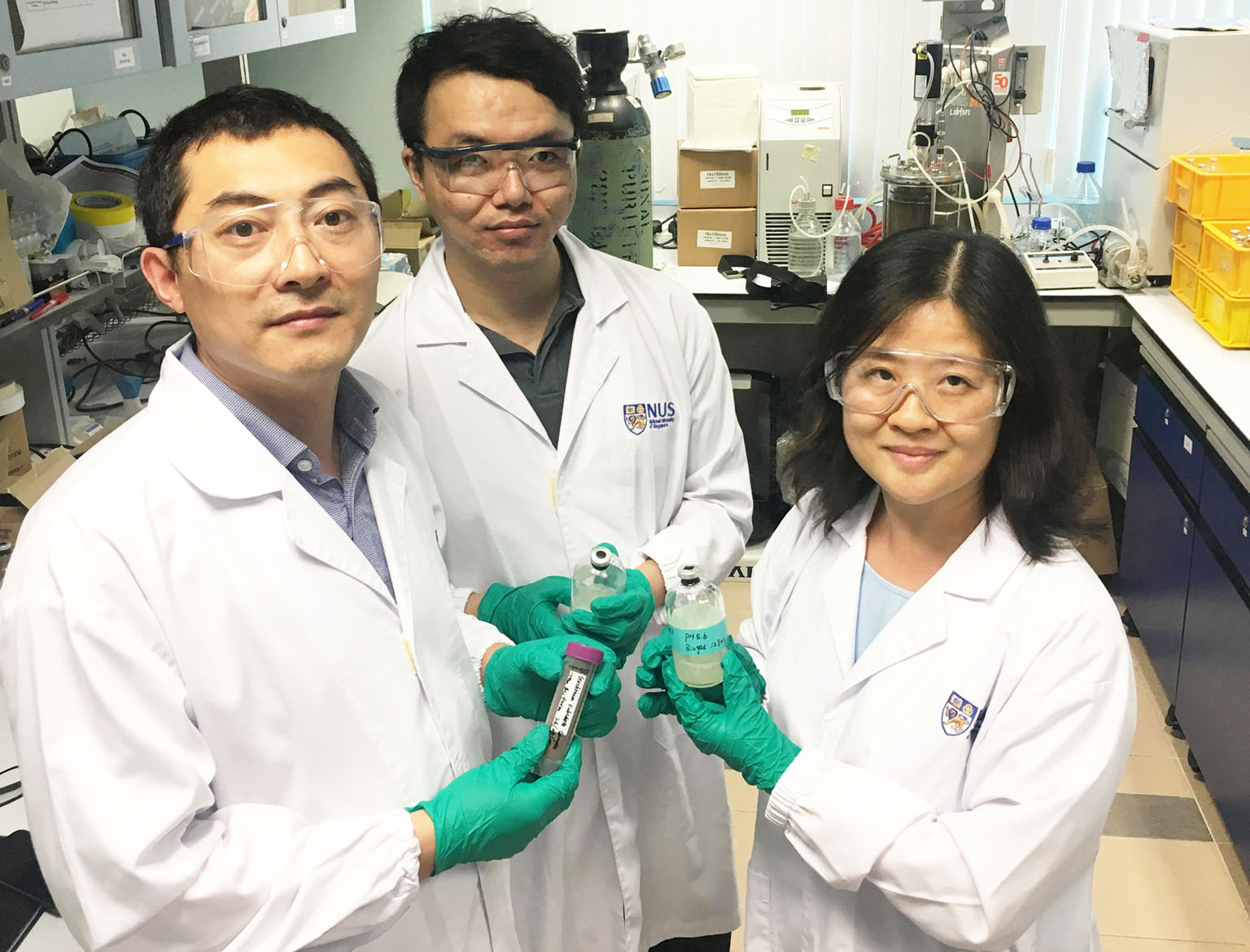 (From left): Dr Li Tinggang, research fellow; Mr Zhang Chen, a PhD student; and Associate Professor He Jianzhong from the Department of Civil and Environmental Engineering at NUS are part of a team that has found that a natural bacterium isolated fro
