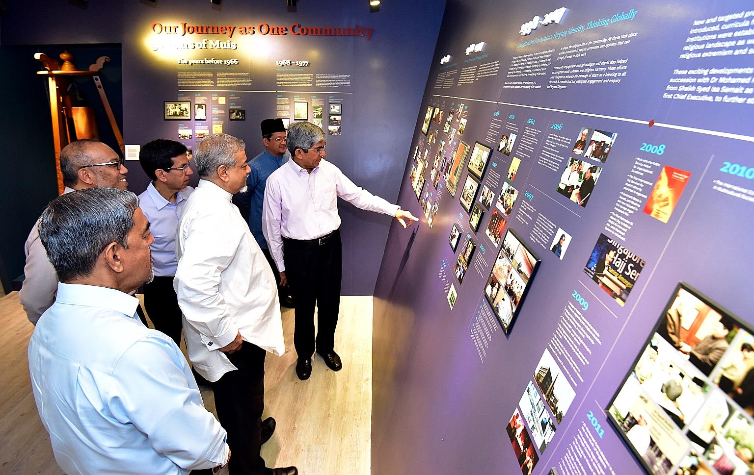 Minister-in-charge of Muslim Affairs Yaacob Ibrahim (far right) with members of Muis' senior management at a new gallery showcasing the history of Muis at the Singapore Islamic Hub yesterday.