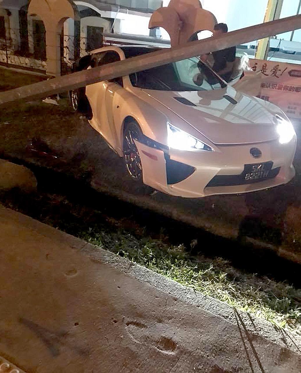 The driver of the white Lexus LFA is believed to have lost control of the vehicle. A video posted on Facebook shows the car swinging from side to side before veering sharply to the left, cutting in front of a bus. It stopped only when it crashed into