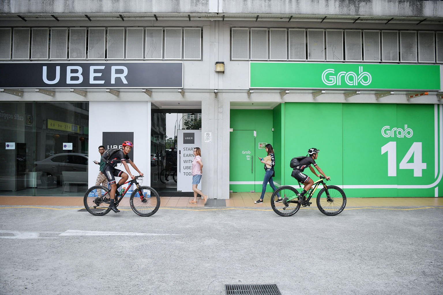 That Grab and Uber failed to notify Singapore's competition watchdog of their "merger" before the deal was closed and implemented raises many questions about their underlying strategic motivations, says the writer.