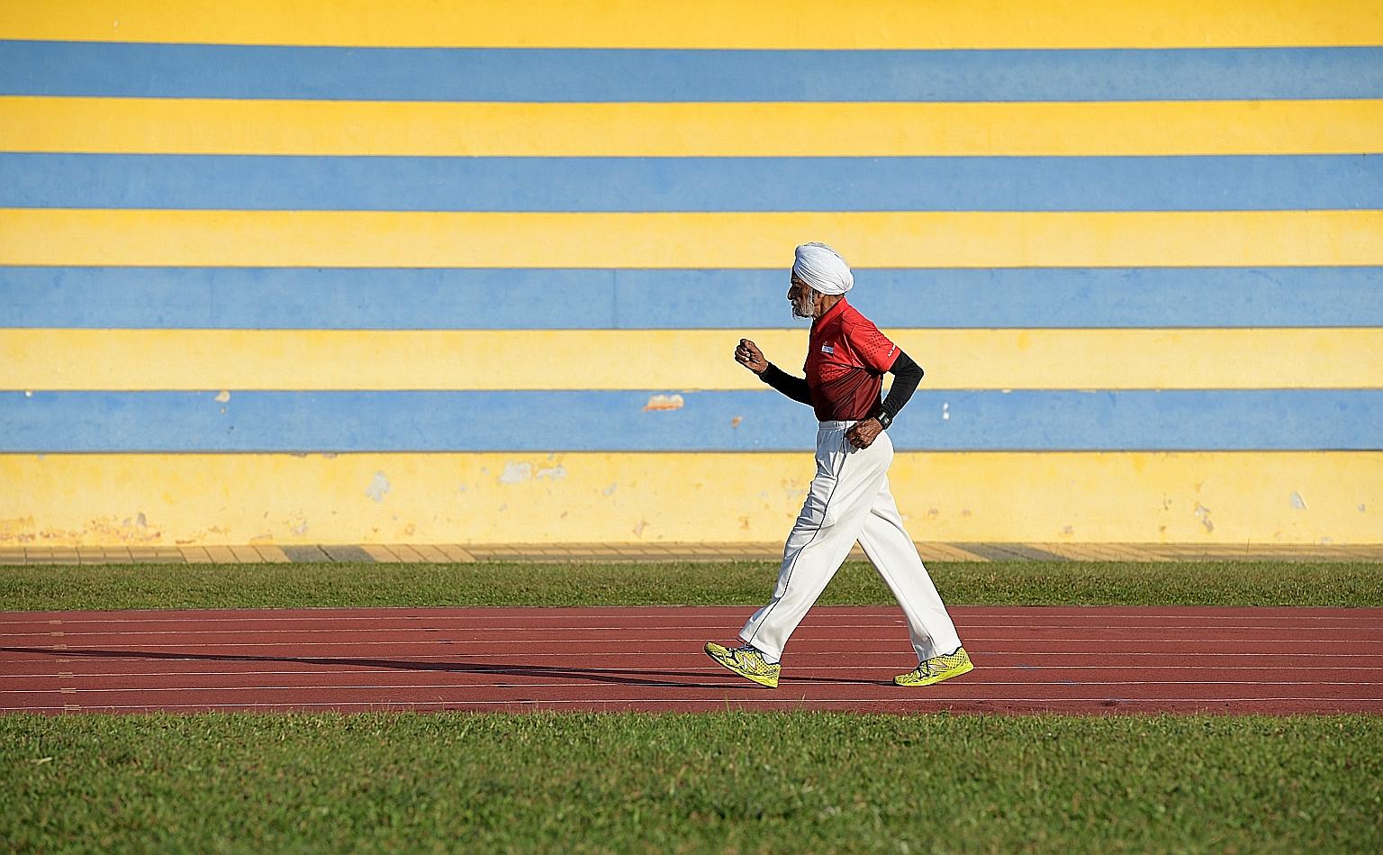 Mr Ajit Singh Gill training at Yio Chu Kang Stadium. He has represented Singapore in hockey, cricket and golf, and at the 1956 Melbourne Olympics. Now, he has taken up race walking and has won gold five times in regional events.