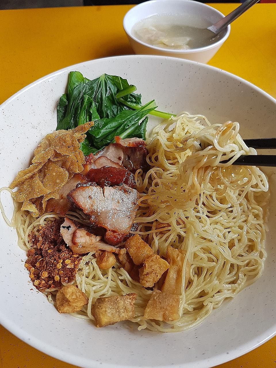 Fatty Thai offers only pig trotter rice (left) and Thai-style wonton mee (far left).