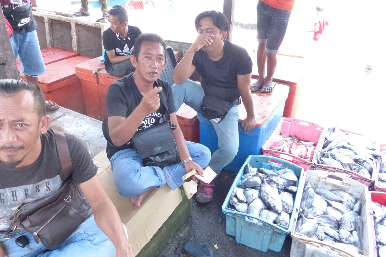 The rising cost of living is an issue for voters like fisherman Abdul Ghafar Radin (centre) in Sabah. Some political analysts based there believe former Umno vice-president Shafie Apdal has an even chance of overthrowing the Umno-led state government