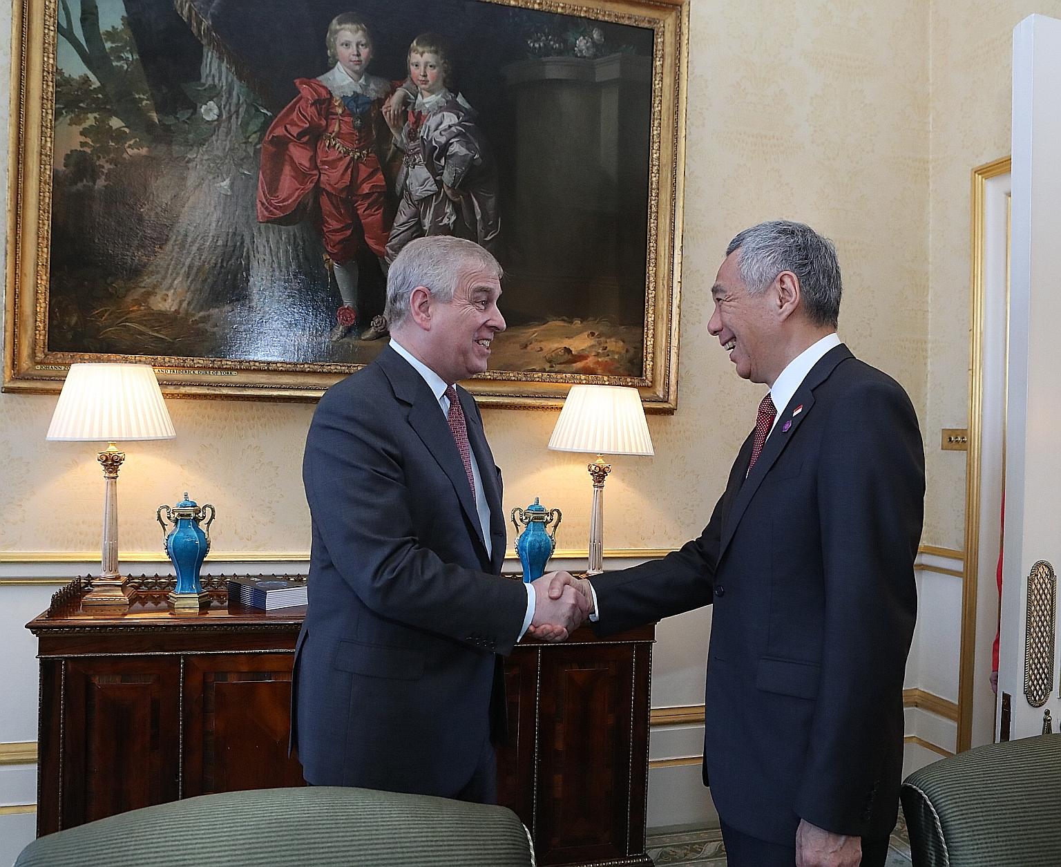 Prime Minister Lee Hsien Loong meeting Britain's Prince Andrew in London yesterday on the sidelines of the Commonwealth Heads of Government Meeting.