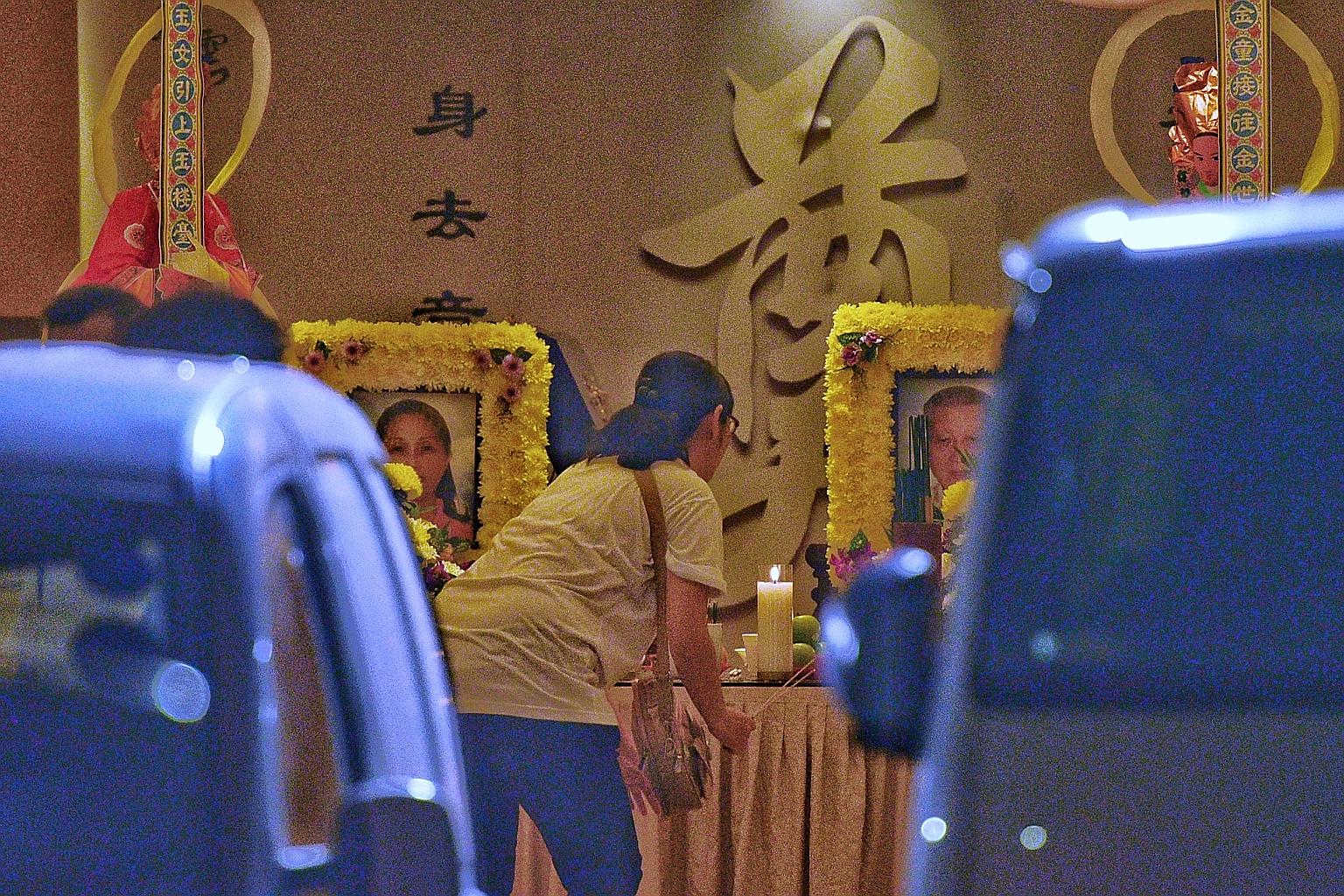 The wake for Madam Gina Chua Aye Wah and her father Chua Cheng Thong, at the funeral parlour in Sin Ming Drive yesterday. They were standing on the pavement in Ang Mo Kio Avenue 6 near the Yio Chu Kang MRT station, along with Mr Yap Soon Huat, when t