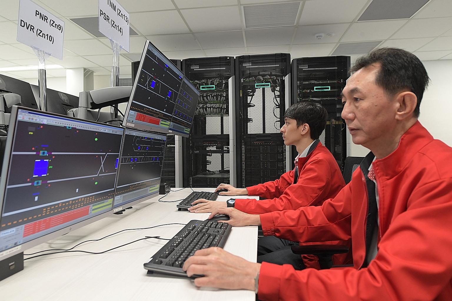 SMRT engineers at the signalling simulation centre at Bishan Depot yesterday. LTA said the new centre allows software issues to be identified and located quickly during testing of the communications-based train control system.
