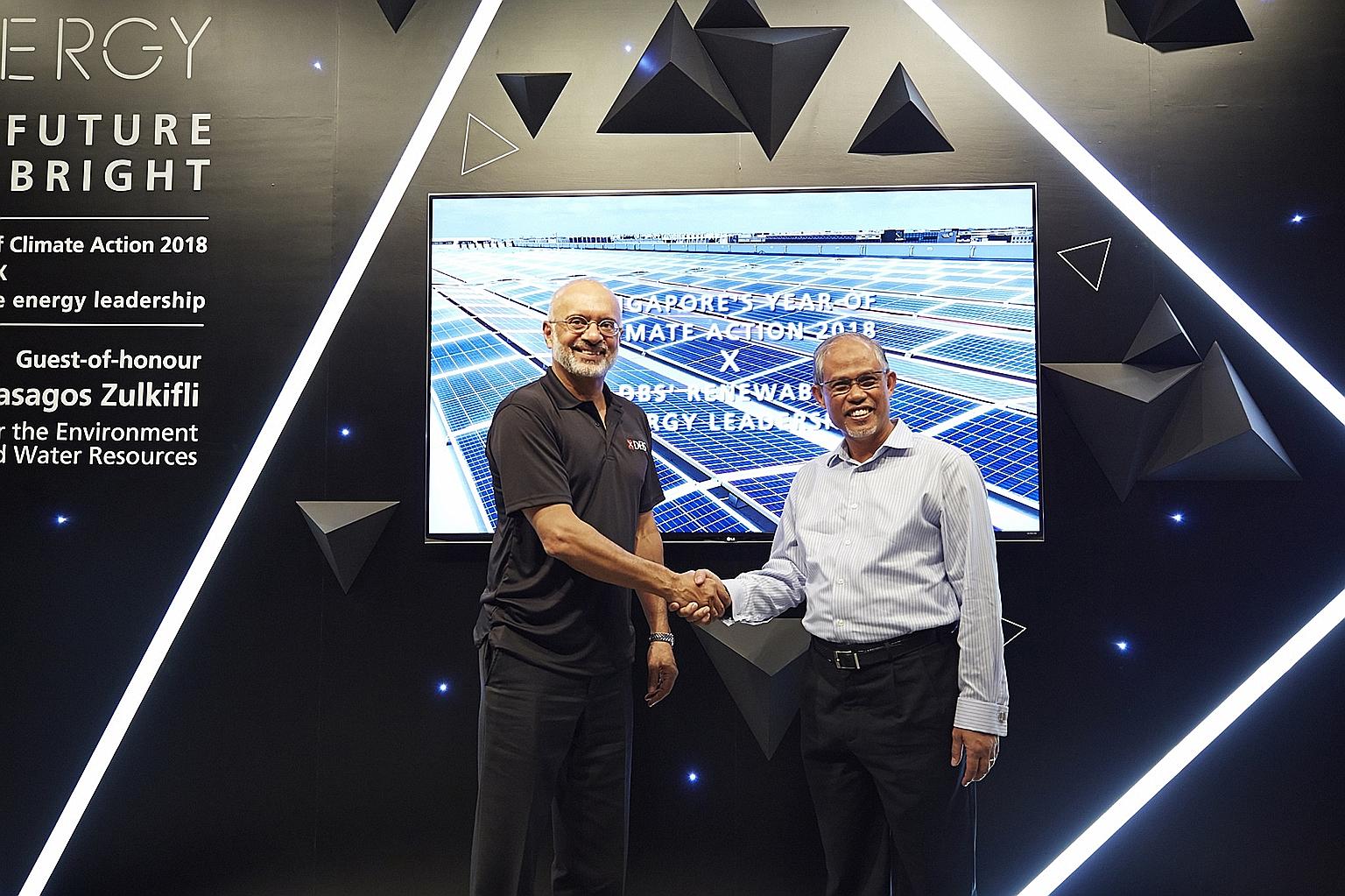 DBS chief executive Piyush Gupta (left) and Minister for the Environment and Water Resources Masagos Zulkifli at the launch of a solar energy installation at DBS Asia Hub yesterday.
