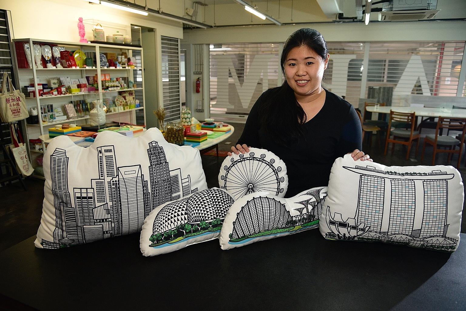 Brand manager Mabel Low shows off the The Farm Store's cushions featuring the Singapore skyline. Ms Low says tourists are seeking products that really tell what it is like to experience Singapore, rather than the usual trinkets.