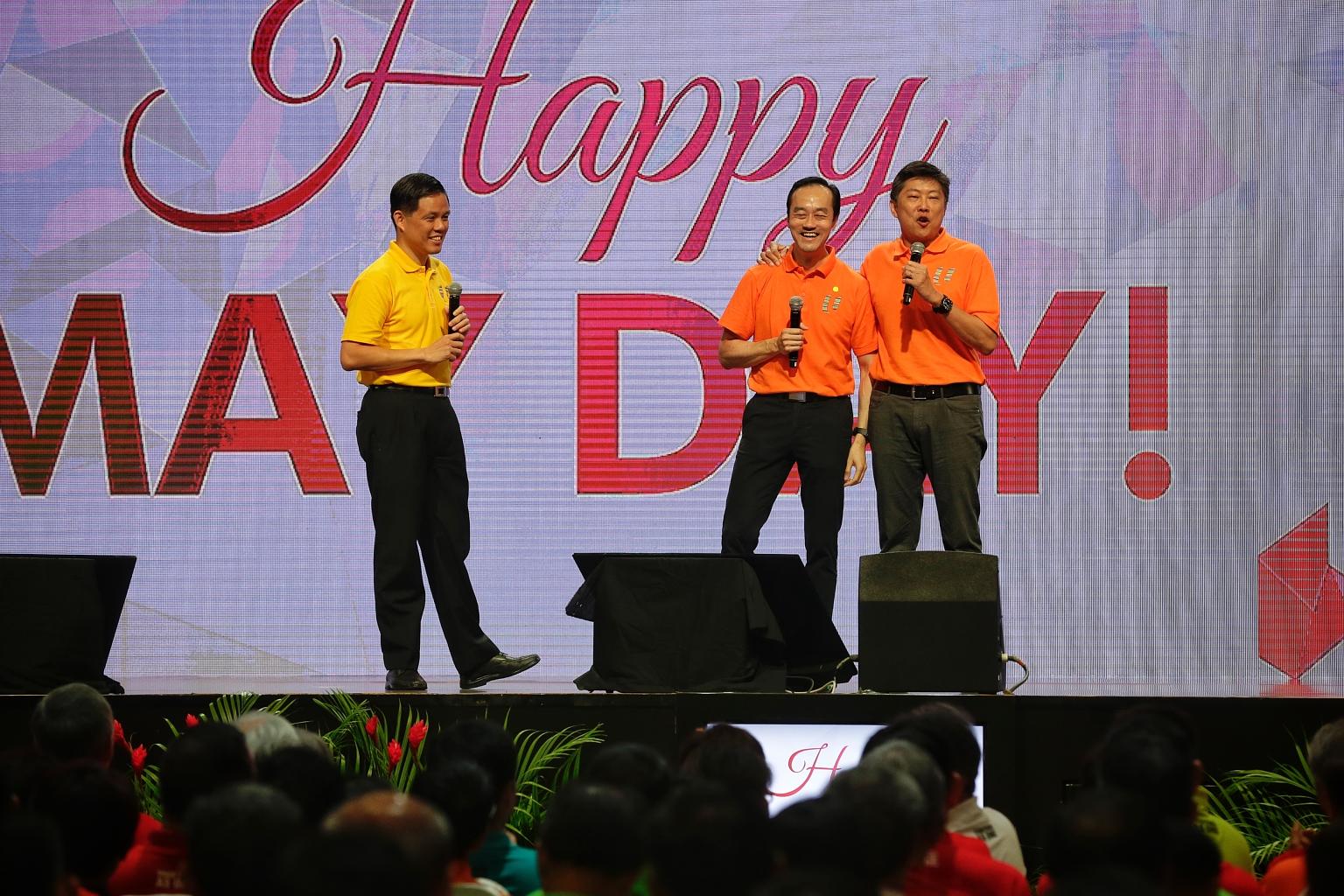 NTUC secretary-general Chan Chun Sing (far left) introducing deputy secretaries-general Koh Poh Koon (centre) and Ng Chee Meng on stage during the May Day Rally at D'Marquee in Downtown East yesterday. Mr Ng is set to succeed Mr Chan as labour chief,
