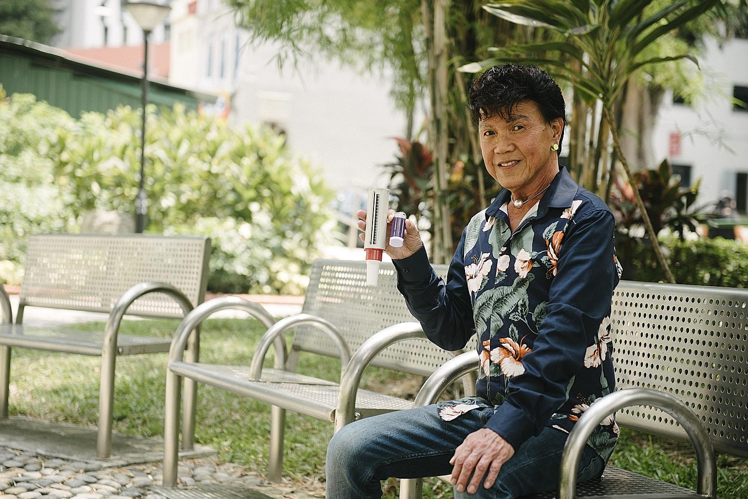 Retiree Daniel Leong, 68, with his purple inhaler and peak flow meter to measure his ability to push air out of the lungs. He was diagnosed with adult-onset asthma 14 years ago and has been taking medication to control it.
