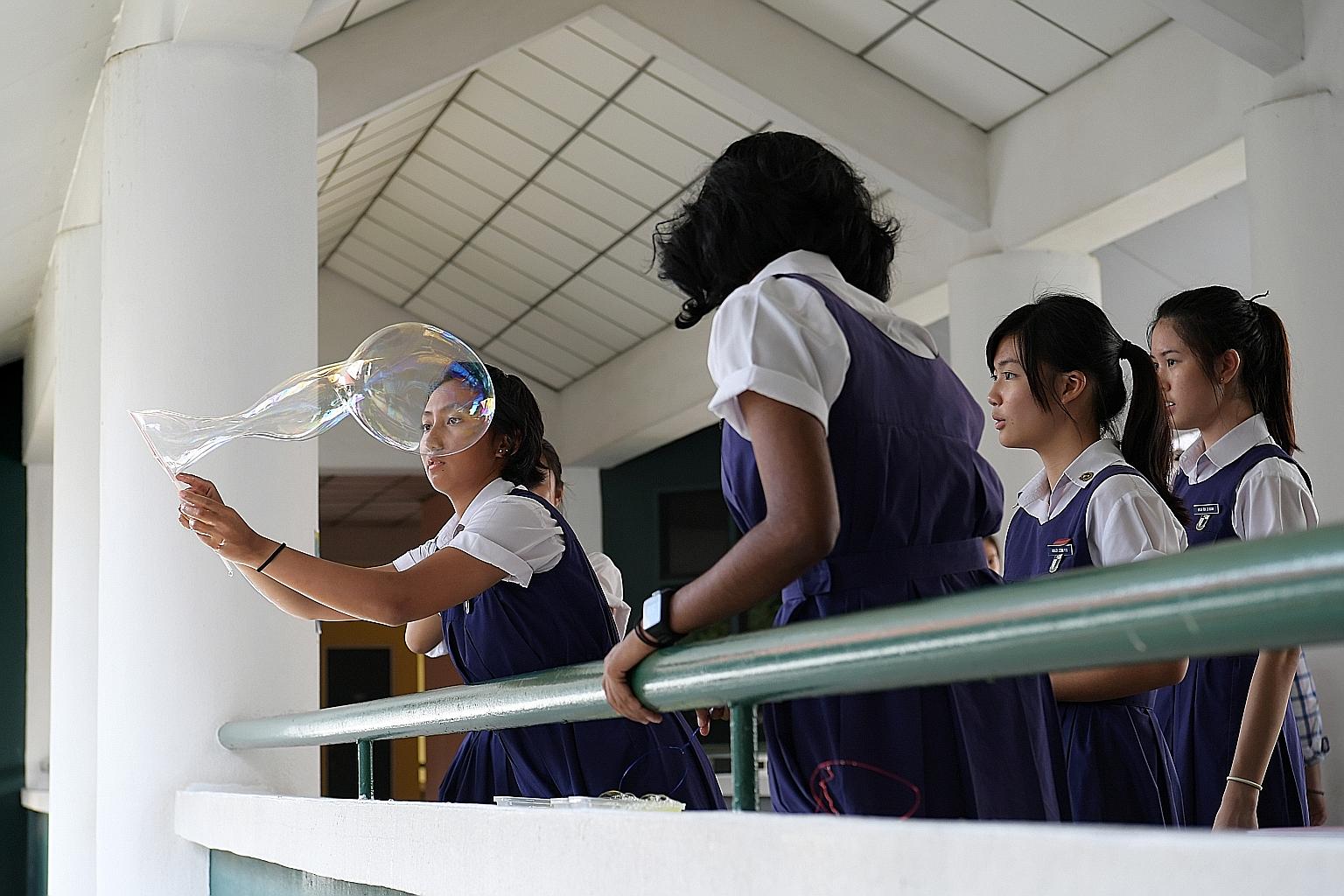 Mr Ang Wei Neng (Jurong GRC) estimated that fewer than half of the students from Raffles Institution and Raffles Girls' School (right) now come from "non-elite" primary schools, compared with about two-thirds some 30 years ago. He called on the Educa