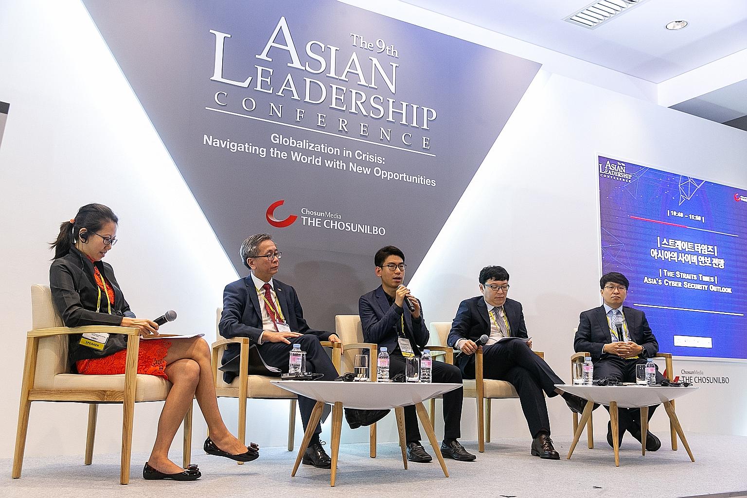 From left: ST senior technology correspondent Irene Tham moderated a panel discussion on cyber security at the Asian Leadership Conference in Seoul, which featured Mr David Koh of the Cyber Security Agency of Singapore, Mr Choi Sang Myung of Hauri, M