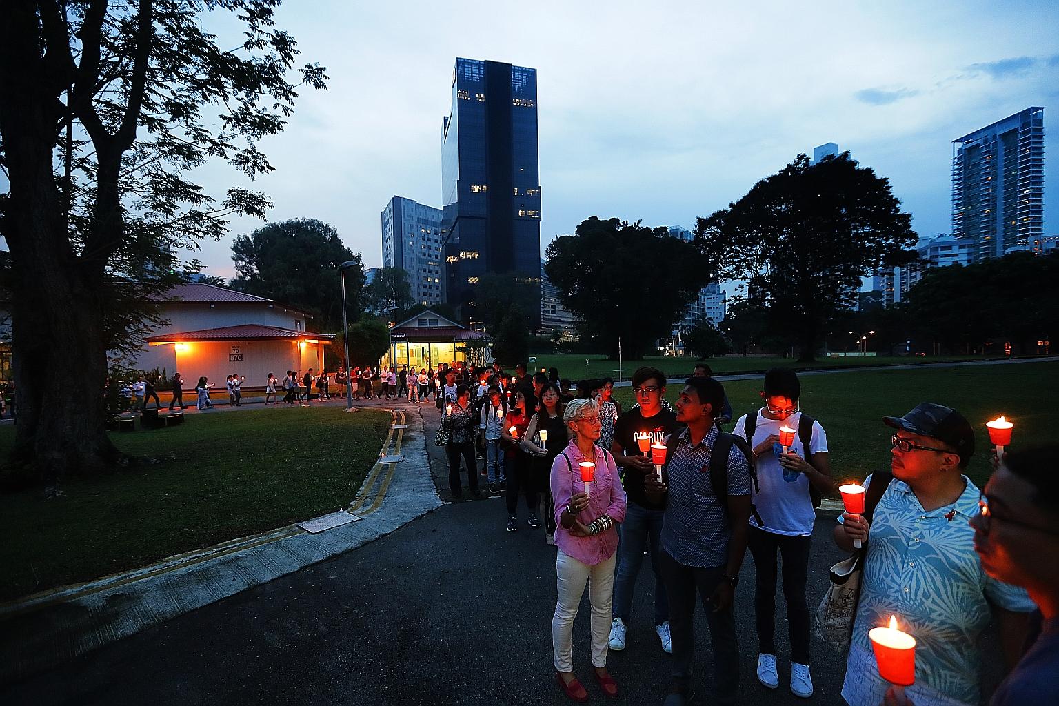 About 100 people, including those with HIV, their friends, families and healthcare workers, gathered to light candles and silently walk the grounds of the Communicable Diseases Centre for the last time yesterday.