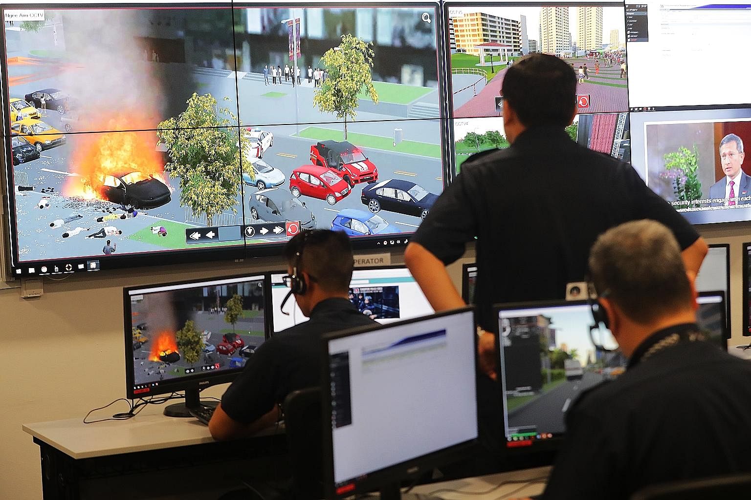 Simulation of a car explosion being monitored in the command post at the Home Team Simulation Centre. The simulation system allows up to 20 commanders from different departments to be trained in joint operations. A simulation exercise can take up to 