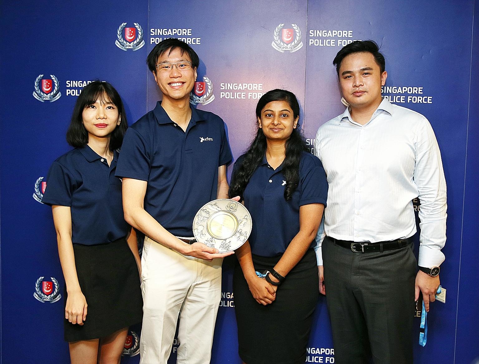 At the appreciation ceremony at the Police Cantonment Complex were Xfers team members (from left) marketing executive Zoe Duong; co-founder and chief legal officer Samson Leo; legal and compliance executive Swathi Bhat; and senior compliance officer 