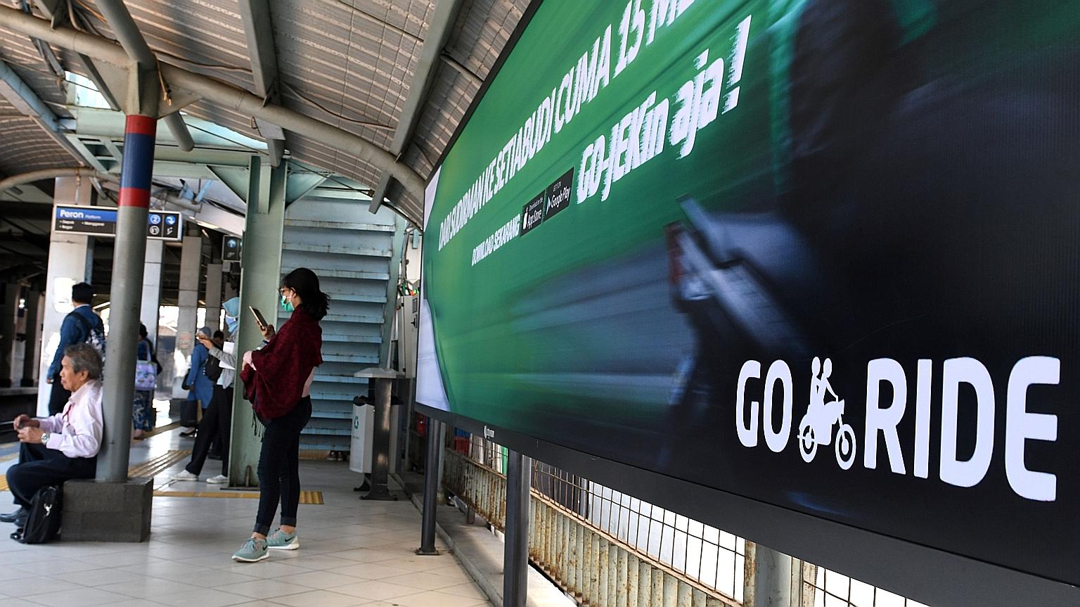A Go-Jek ad at a railway station in Jakarta. The Indonesian ride-hailing firm said it would spread its services to the Philippines, Singapore, Thailand and Vietnam in the next few months, without specifying any dates.
