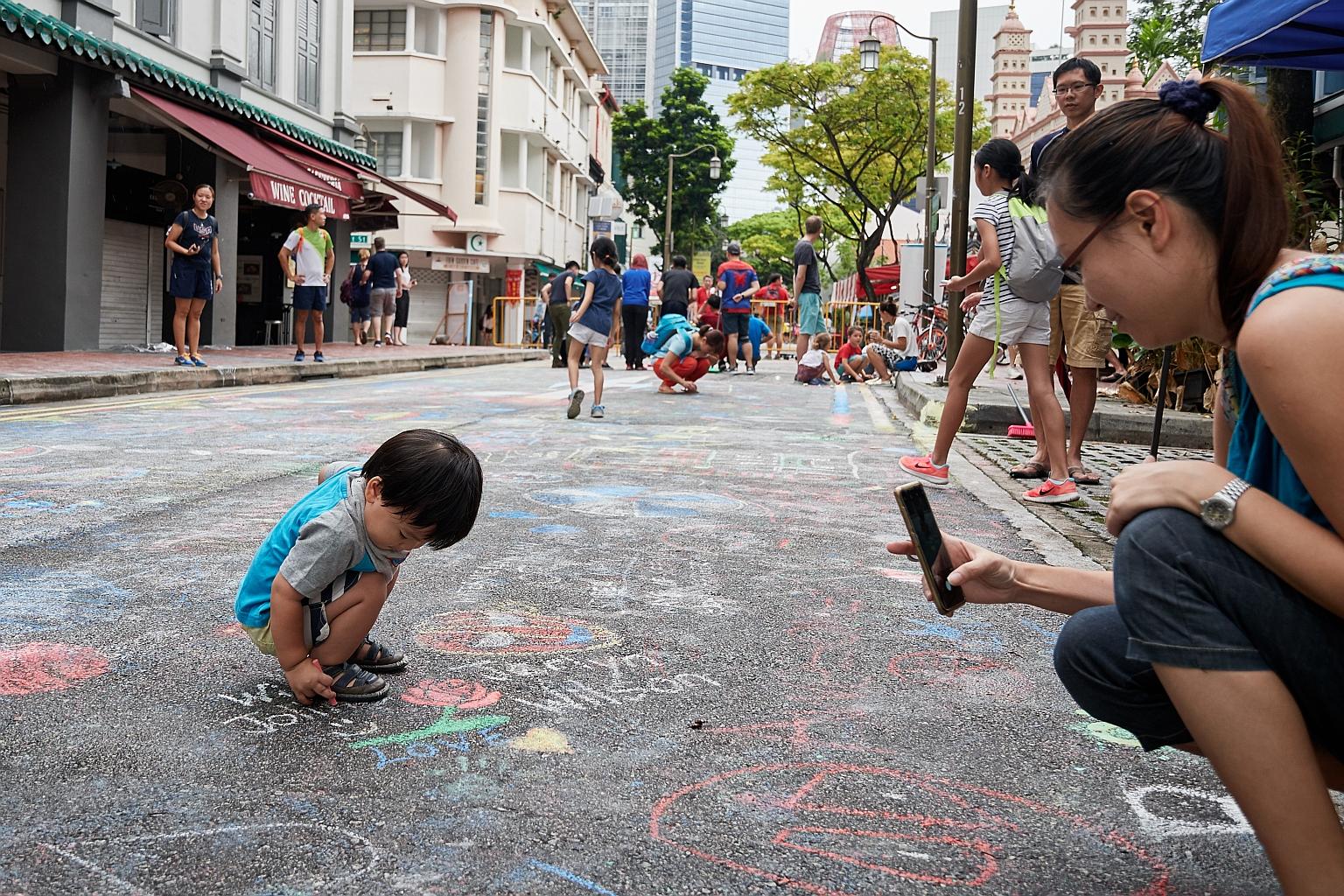 The public got to unleash their creativity on a stretch of road in Telok Ayer as part of Car-Free Sunday SG. The activity aimed to jazz up the area with vibrant chalk art. Car-Free Sunday SG, which saw several roads in Telok Ayer, the Civic District 