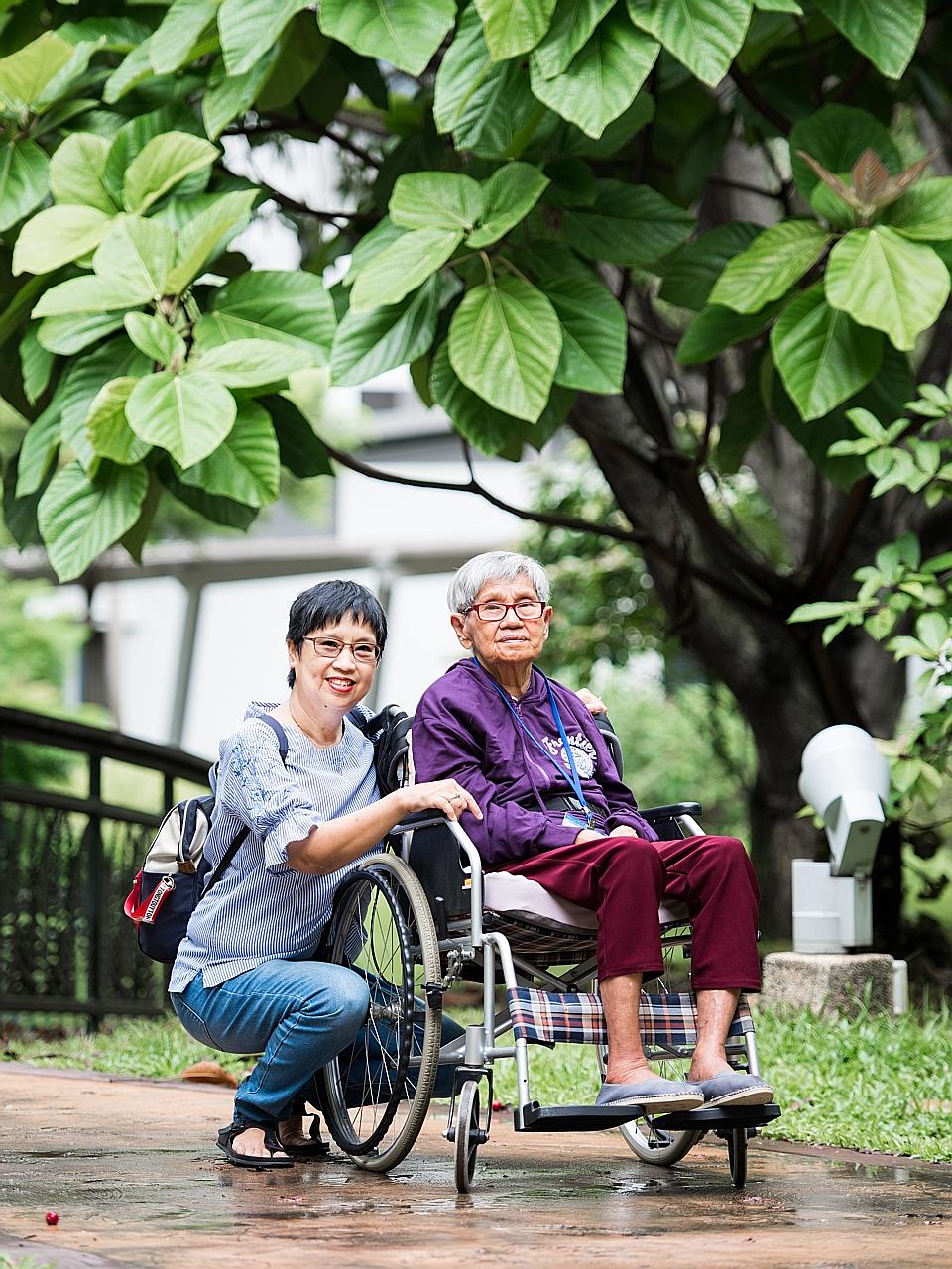 Madam Sarah Liew (far left) and her mother, Madam Quek Pong. Three years ago, Madam Liew was unable to find a GP willing to go to her mother's home to assess her for dementia.