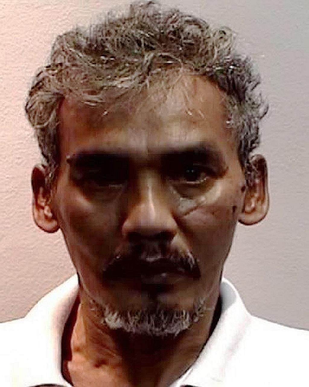 Zainudin Osman, 56, was jailed for over 21 months for several offences, including using criminal force on public servants.