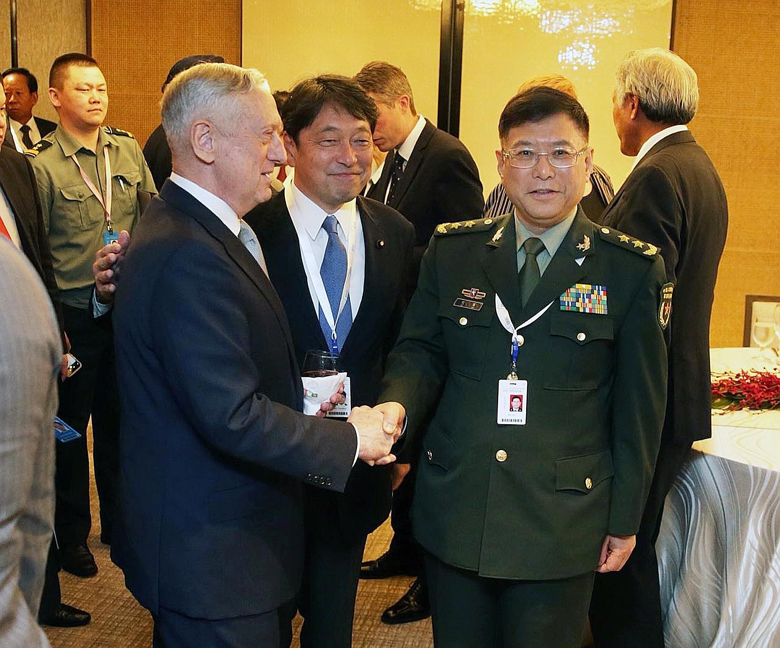US Defence Secretary James Mattis, Japanese Defence Minister Itsunori Onodera and China's Lt-Gen He Lei at the dialogue. Mr Mattis said China's placement of weapon systems in the South China Sea is tied directly to military use for the purpose of int