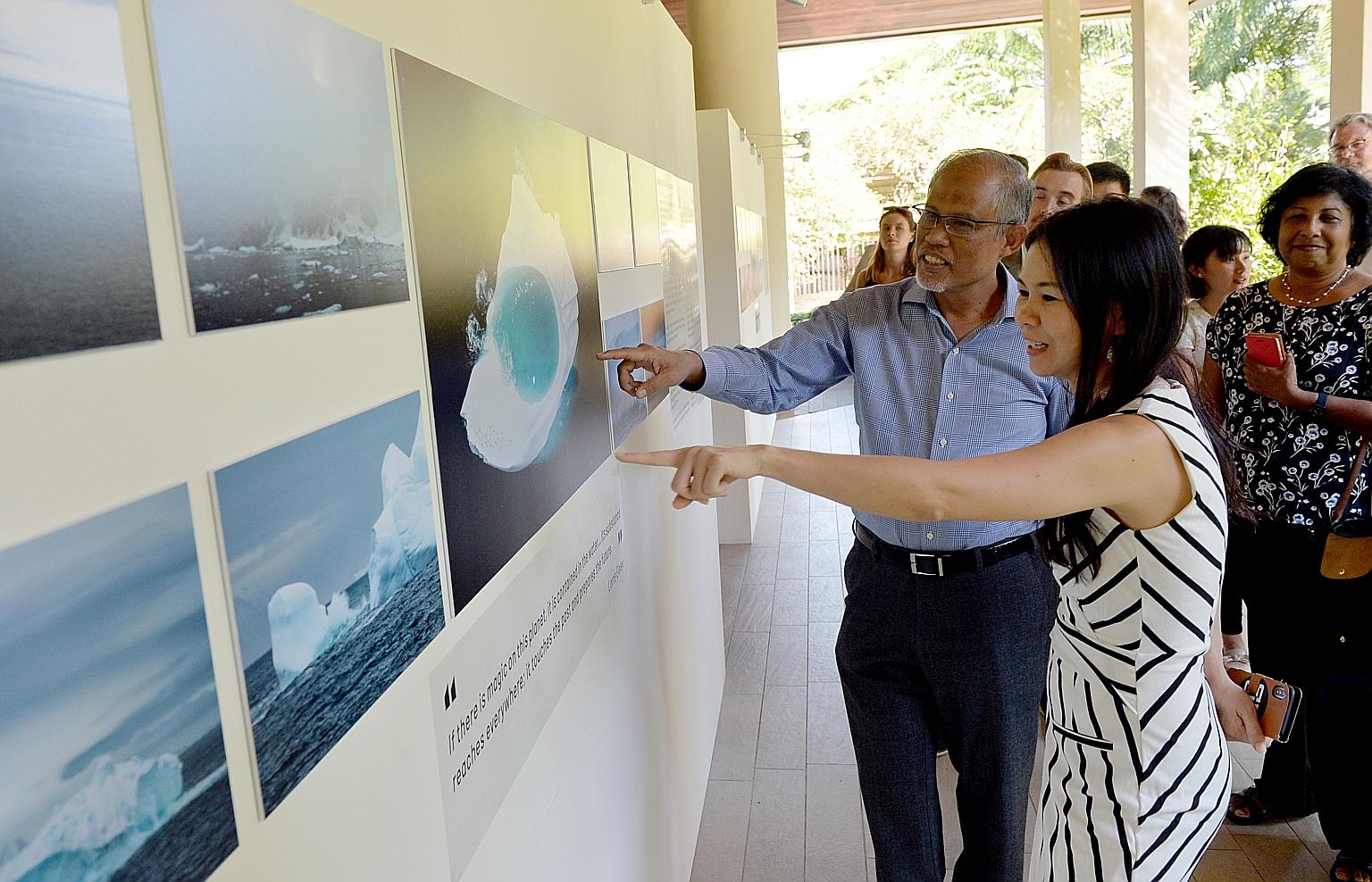 An exhibition to inspire change: Minister for the Environment and Water Resources Masagos Zulkifli at the opening of "Changing Course", a film and photography exhibition which tells stories about the impacts of climate change. With him is Jessica Che