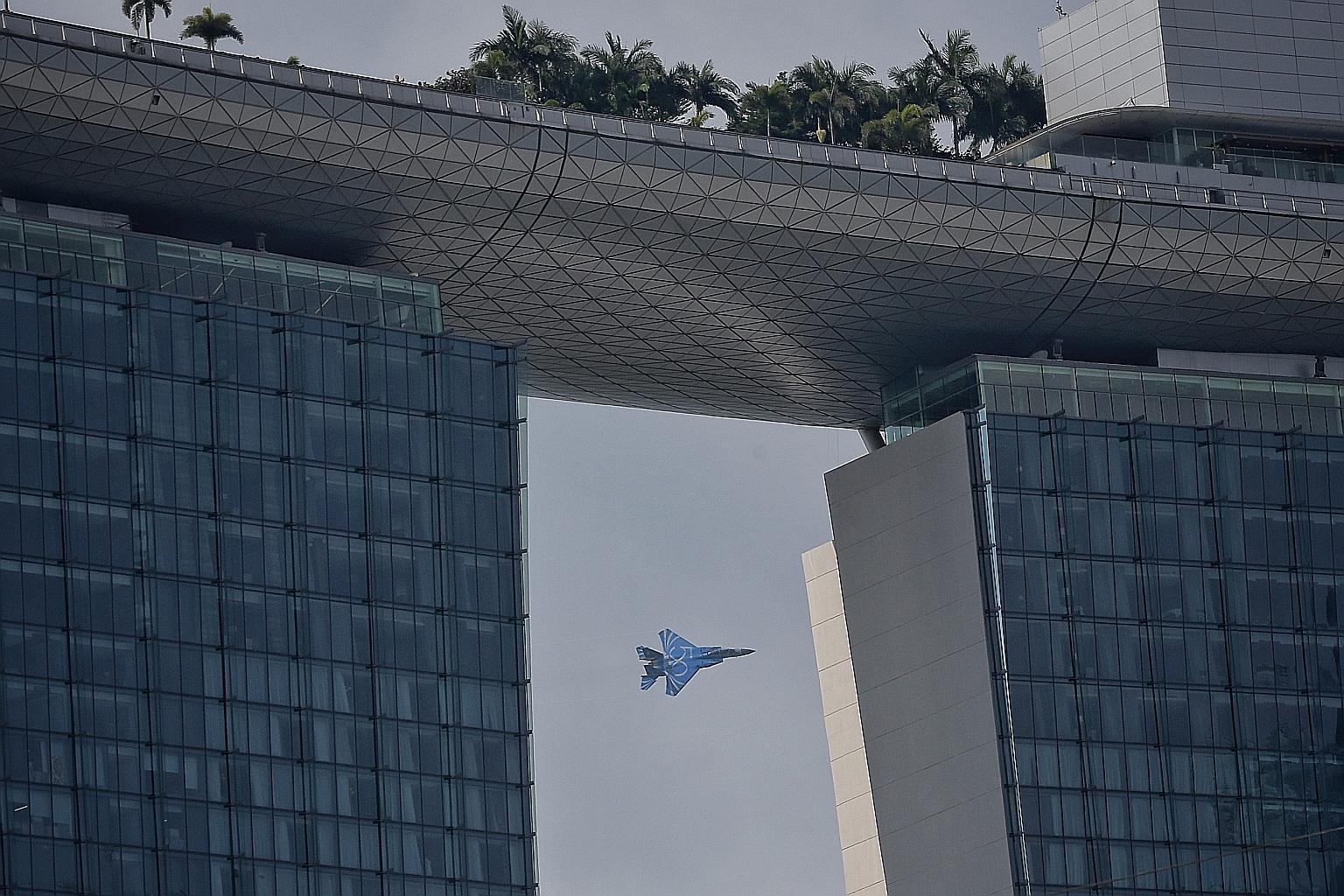 The Republic of Singapore Air Force (RSAF) flew an F-15 fighter jet yesterday to give reporters a preview of this year's aerial display for the National Day Parade. The jet is painted blue with the number 50 on its side to celebrate the RSAF's golden