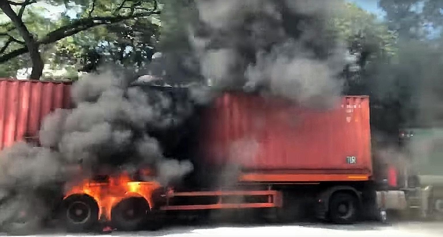 Photos sent to The Straits Times showed plumes of black smoke rising from the trailer. The tyres near the rear were seen to be in flames.