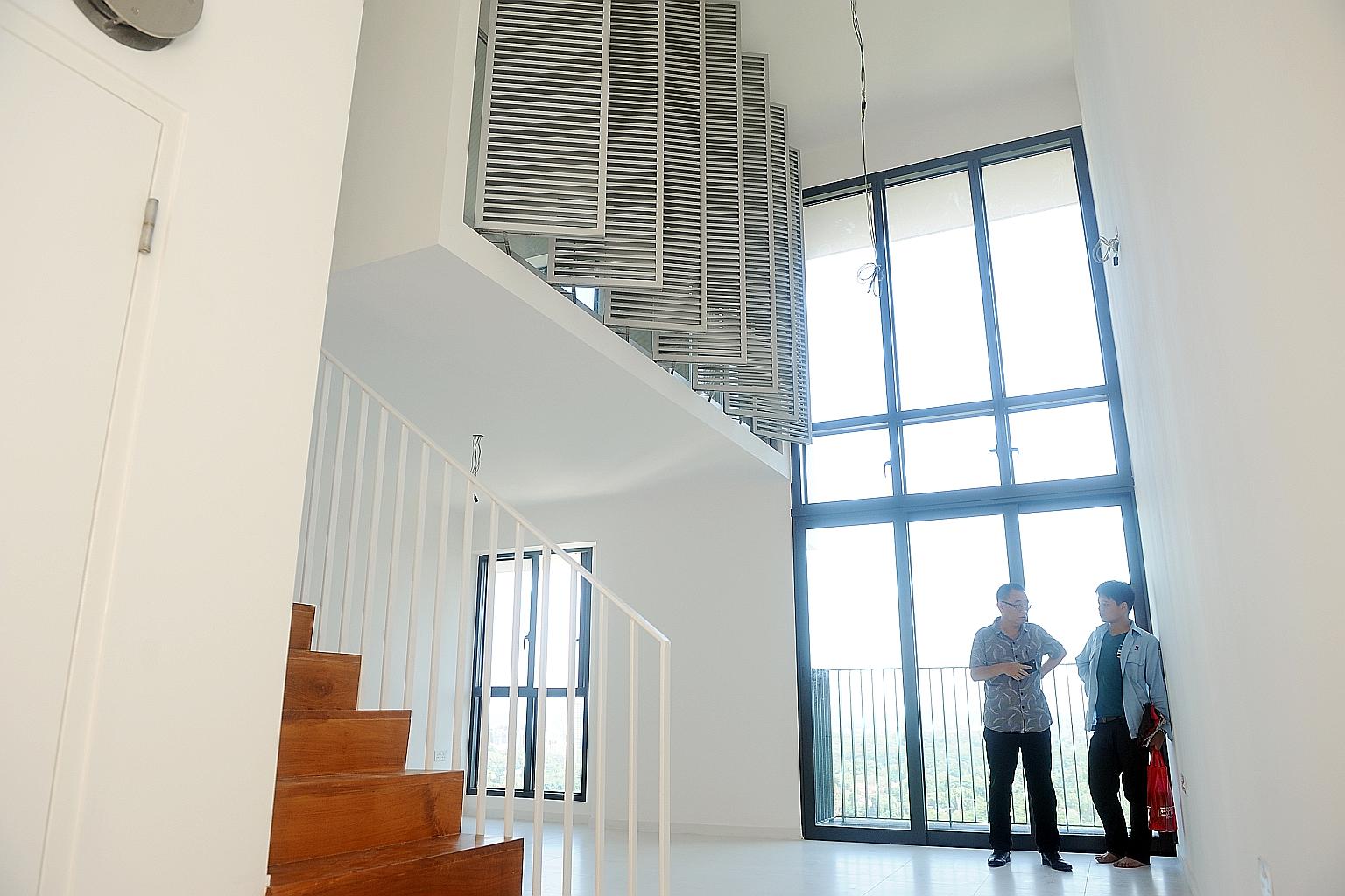 A Housing Board loft unit at SkyTerrace @ Dawson, an example of a high-ceiling design. Such homes have been popular in strata private residences too, but buyers may be charged by private developers for the void space in these projects.
