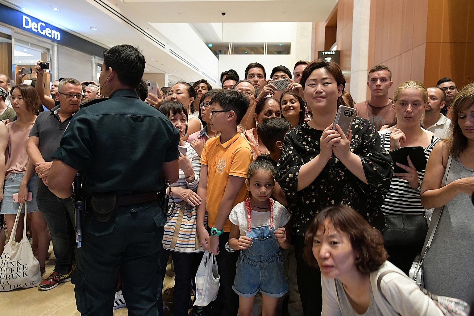 A crowd of curious onlookers gathering at Marina Bay Sands last night hoping to catch a glimpse of North Korean leader Kim Jong Un, who visited the integrated resort as part of a city tour that also included Gardens by the Bay.