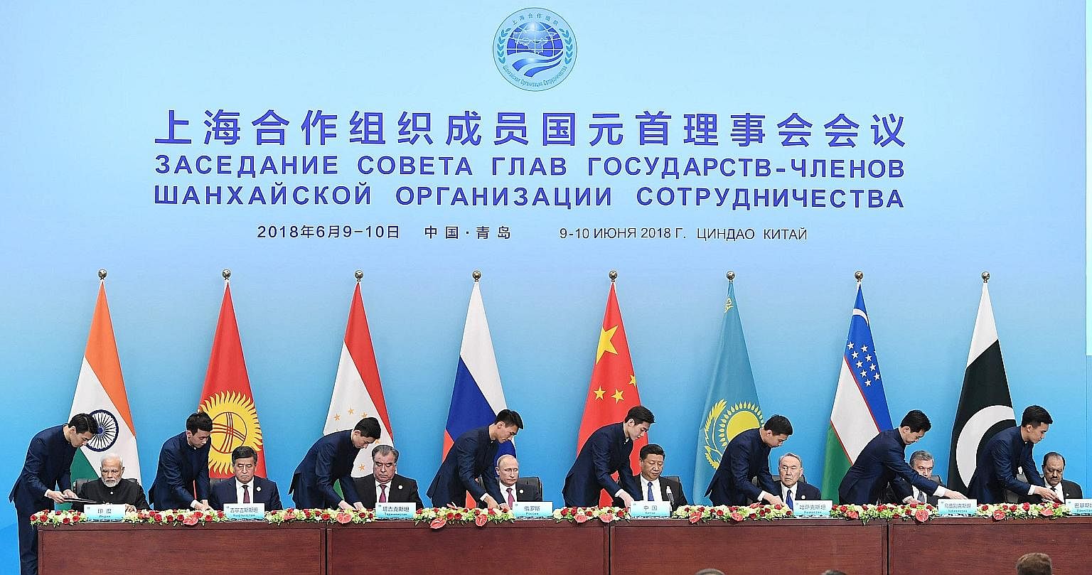 Leaders of the eight countries under the Shanghai Cooperation Organisation at a signing ceremony over the weekend. The China Daily newspaper said the summit was a good example of multilateral cooperation, offering a "new vision" for a more just and e