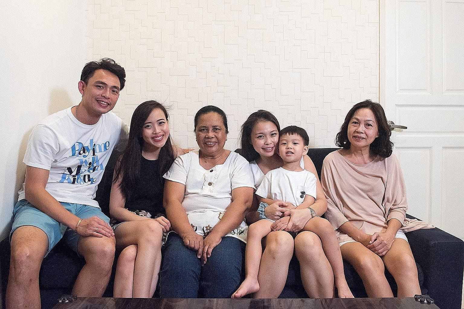 (From left) Mr Alvin Ng, 38, Ms Alicia Ng, 27, Ms Sabado, 65, Ms Agnes Ng, 34, and her four-year-old son Aiden, and Madam Yeong, 60. Ms Sabado helped raise the children and accompanies the family on yearly vacations. Ms Remidios Sabado (in white) wit