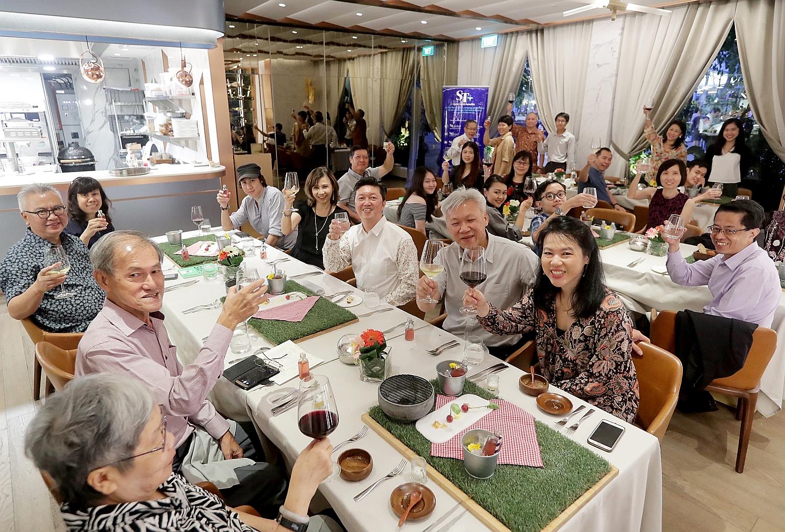 Six ST readers and their families enjoying a Father's Day dinner treat at Curate restaurant at Resorts World Sentosa. The meal boasted a showcase menu by chef Benjamin Halat and was hosted by Straits Times food critic Wong Ah Yoke.