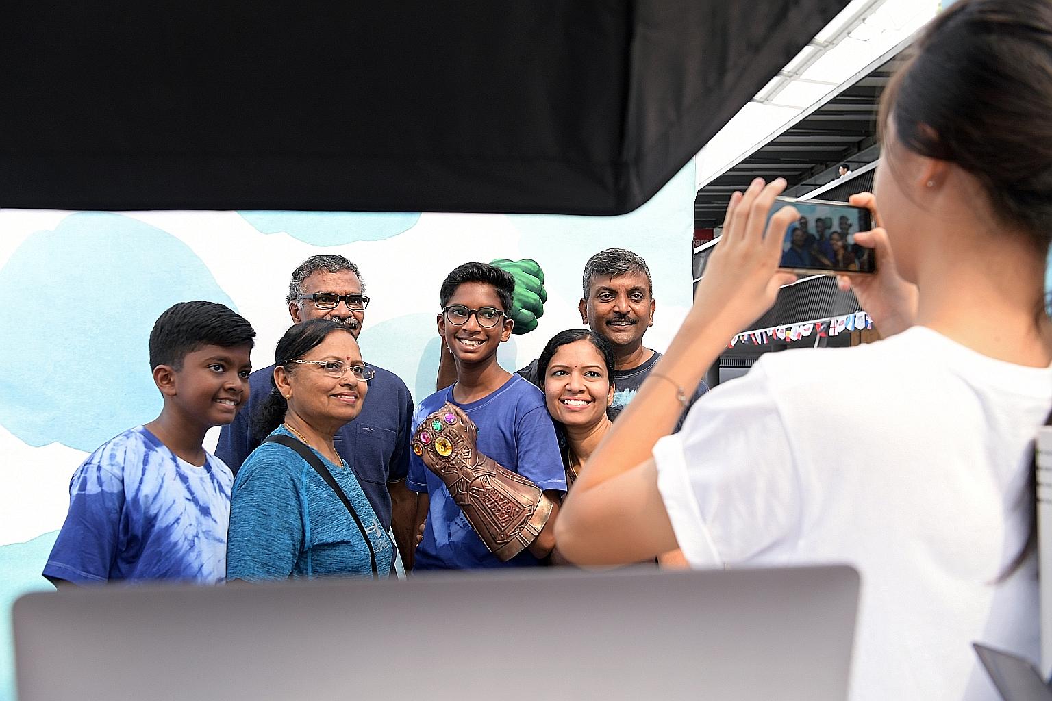 (From far right) Mr Ramdas Danabal with his wife, Ms Leamathi Krishnan, 40; elder son Kavineshaan Ramdas, 14; in-laws Krishnan Murugiah and Devi Maniam, 65; and younger son Sathiyashanan Ramdas, 12, having their family photo taken yesterday at the Da