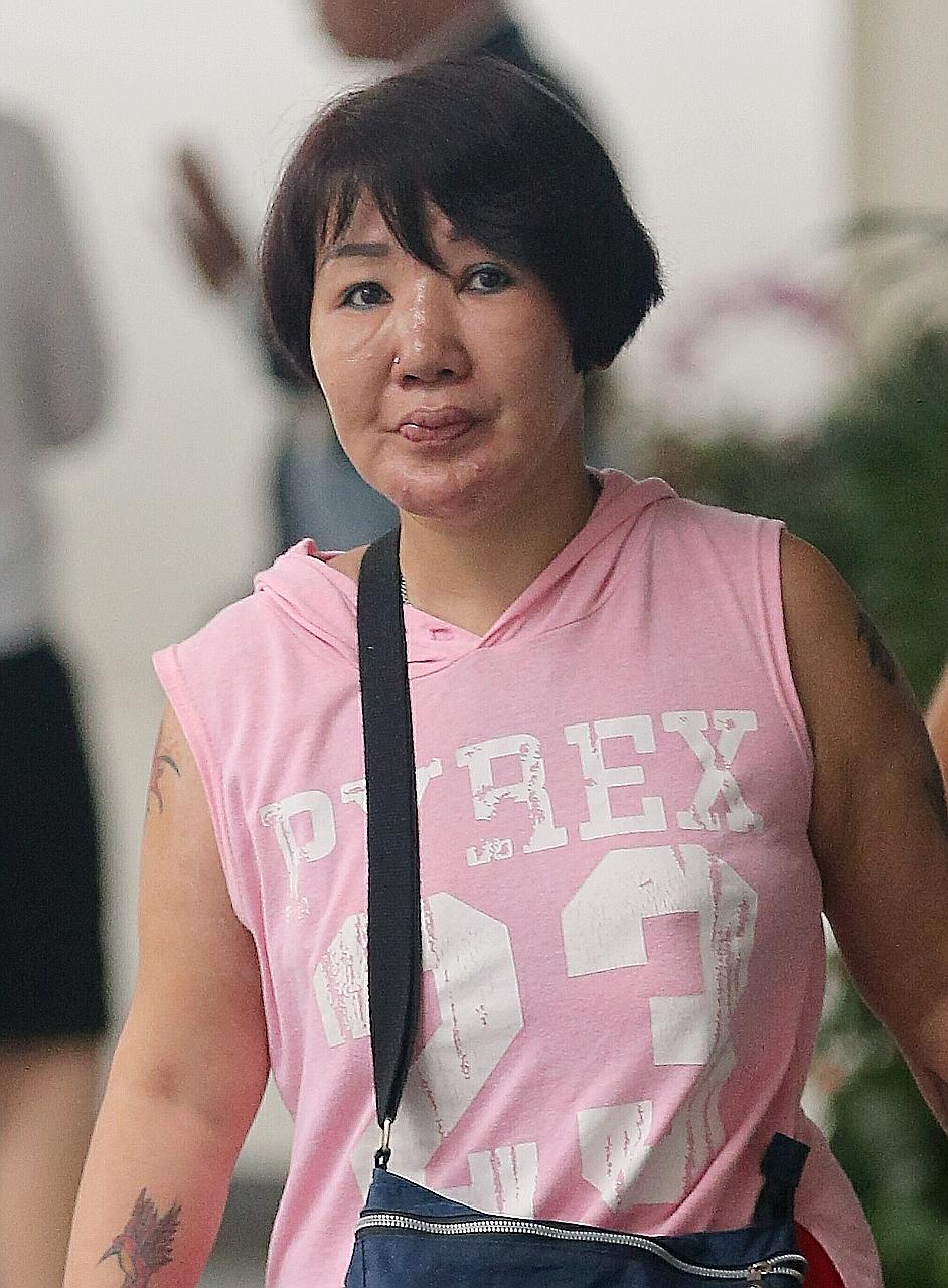 Ms Wendy Tan Li San suffered second-degree burns after her former husband poured hot water on her.