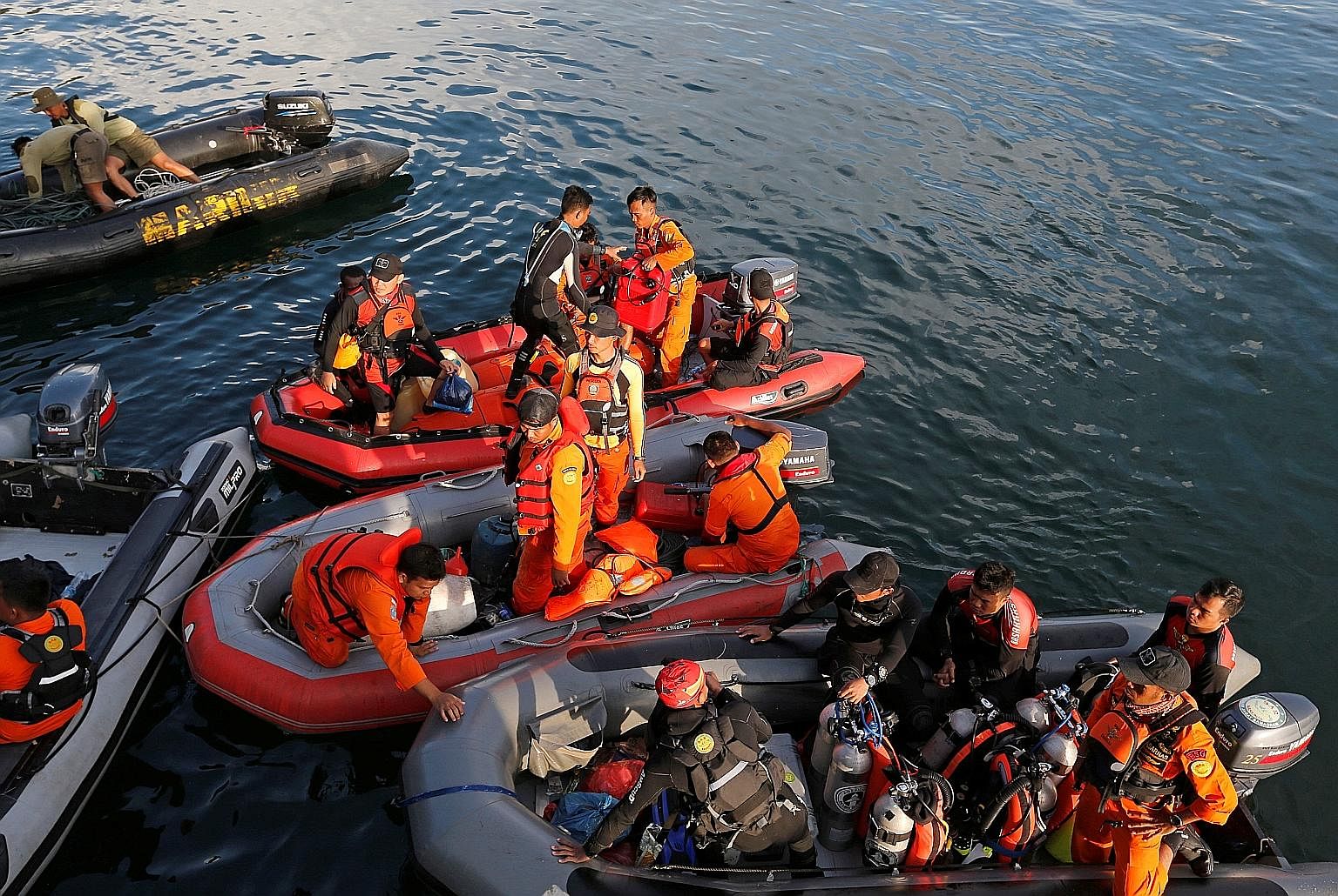 Rescuers looking for missing people after Monday's ferry accident on Lake Toba in Indonesia.