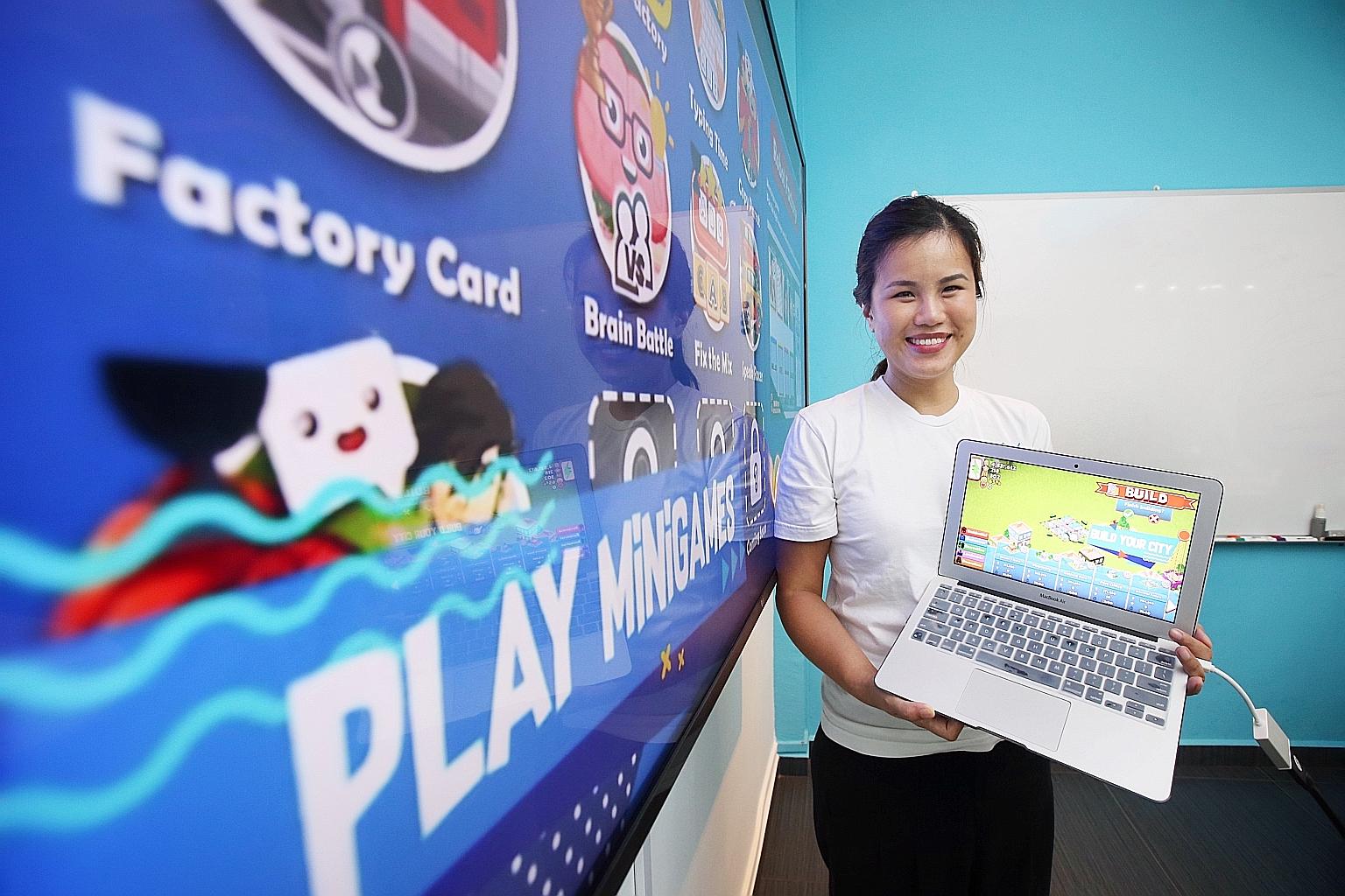 Ms Janine Teo with the learning game her organisation developed to give children access to good-quality education. The scores in the game can be used to measure literacy and numeracy skills.