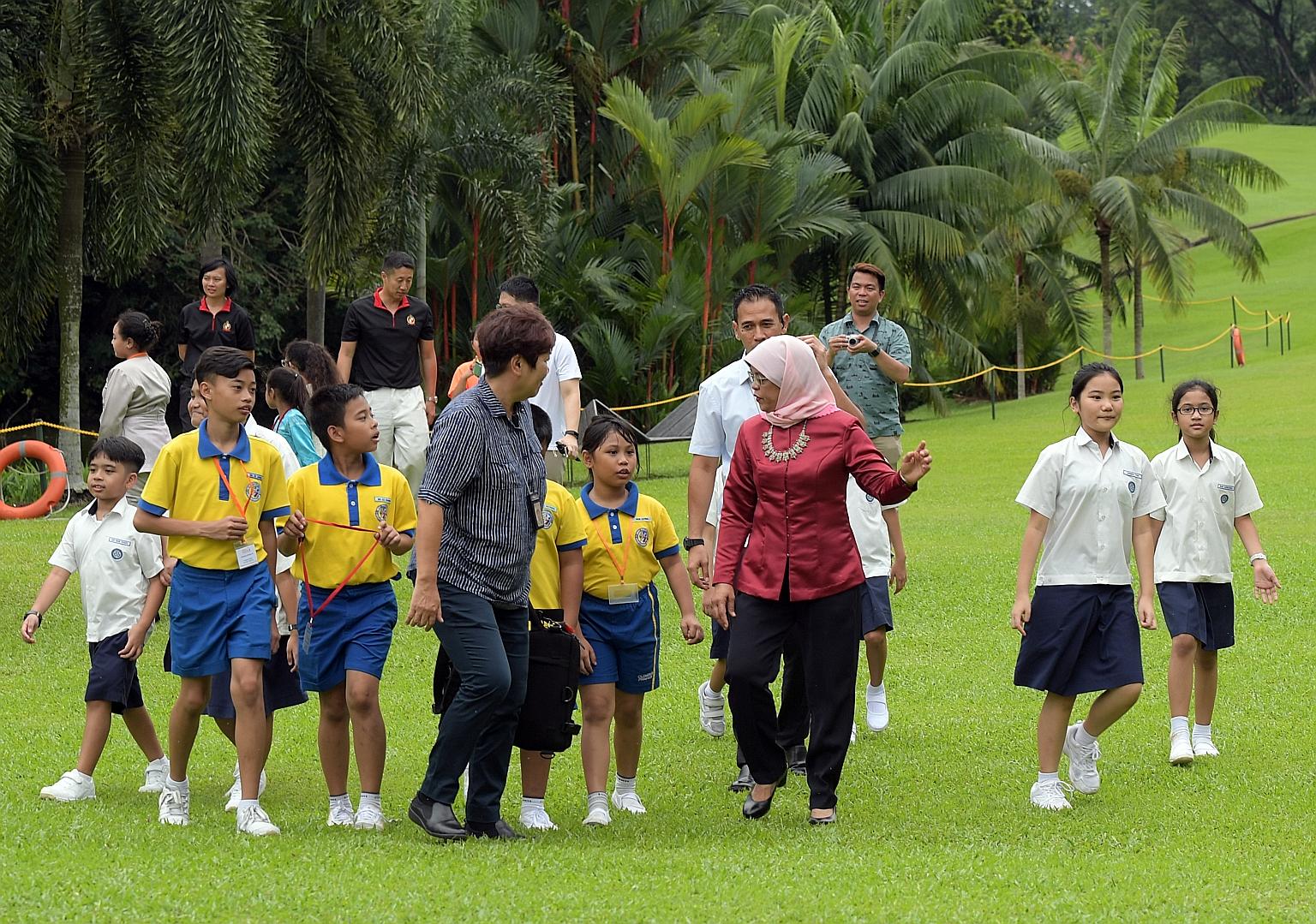 Pupils of Clementi Primary School, Pei Tong Primary School, Princess Elizabeth Primary School and Unity Primary School were given a rare chance to visit the Istana yesterday with a special host - President Halimah Yacob. The learning journey and picn