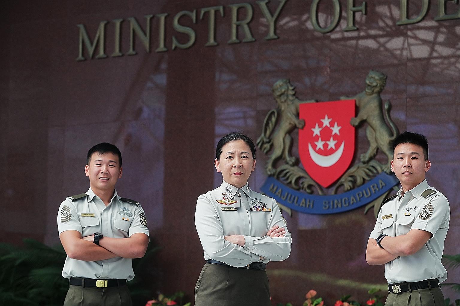Senior Warrant Officer Jennifer Tan, currently Commanding Officer of the Armour Combat Training Centre, with sons Master Sergeant Jason (left) and MSG Jeffrey Ong. She was among over 500 personnel from Mindef and the SAF to be promoted this year. The